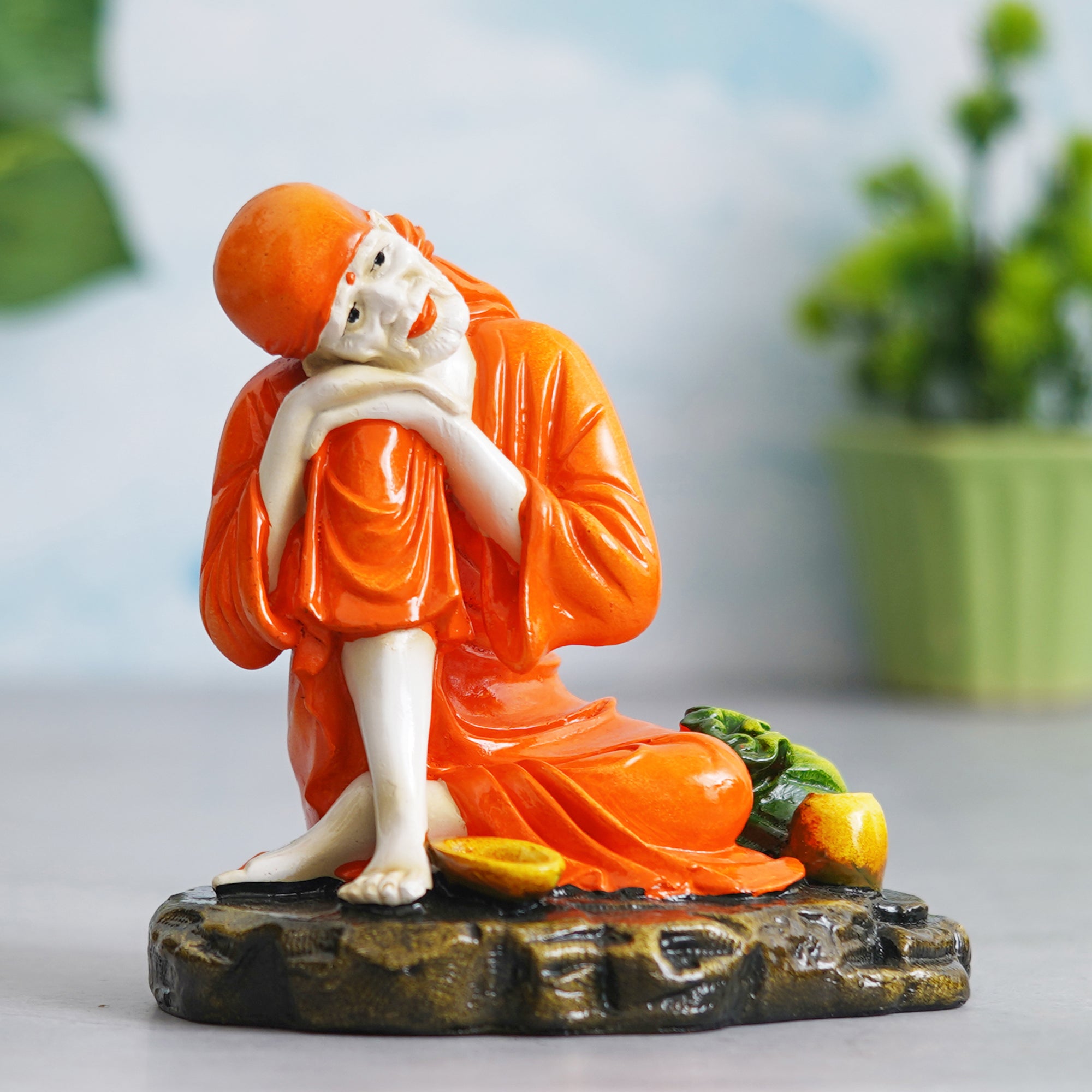 eCraftIndia Orange Polyresin Handcrafted Sai Baba Idol Resting on his Knee 5