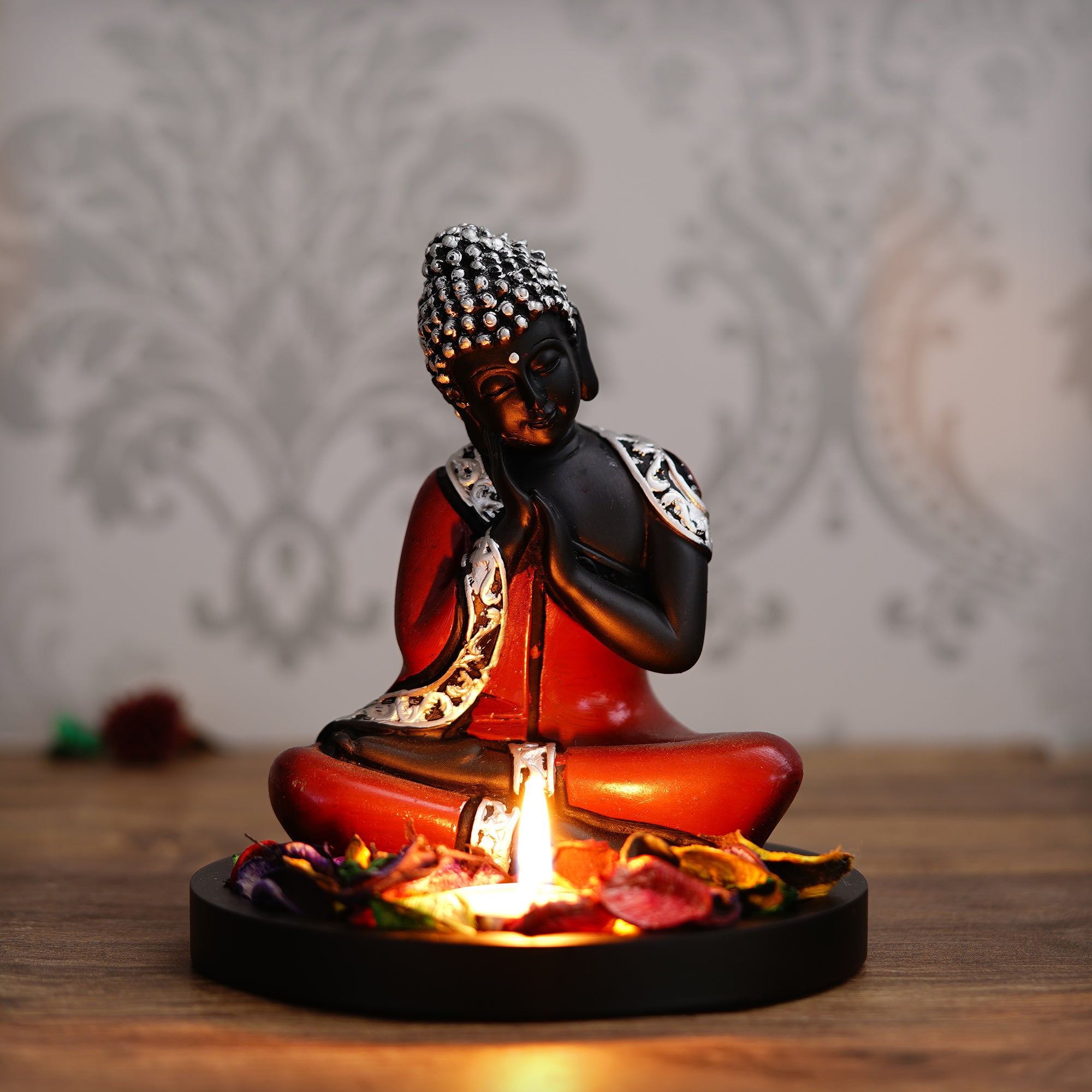 Polyresin Antique Finish Handcrafted Thinking Buddha Statue with Wooden Base, Fragranced Petals and Tealight (Red, Black and Silver) 1