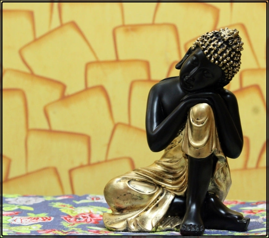 Polyresin Black And Golden Handcrafted Lord Buddha Resting On Knee Statue