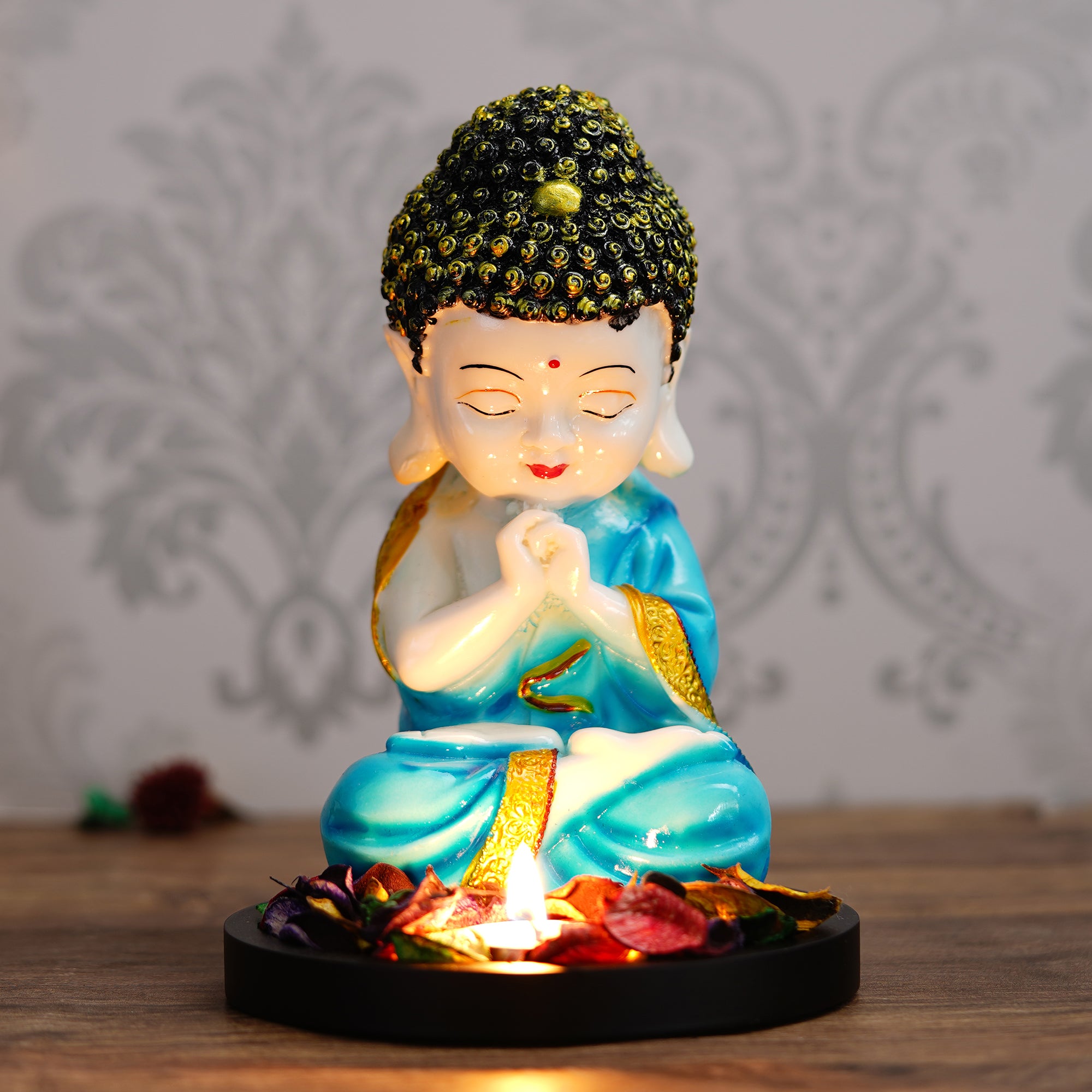 Polyresin Blue and White Praying Monk Buddha Statue with Wooden Base, Fragranced Petals and Tealight 1
