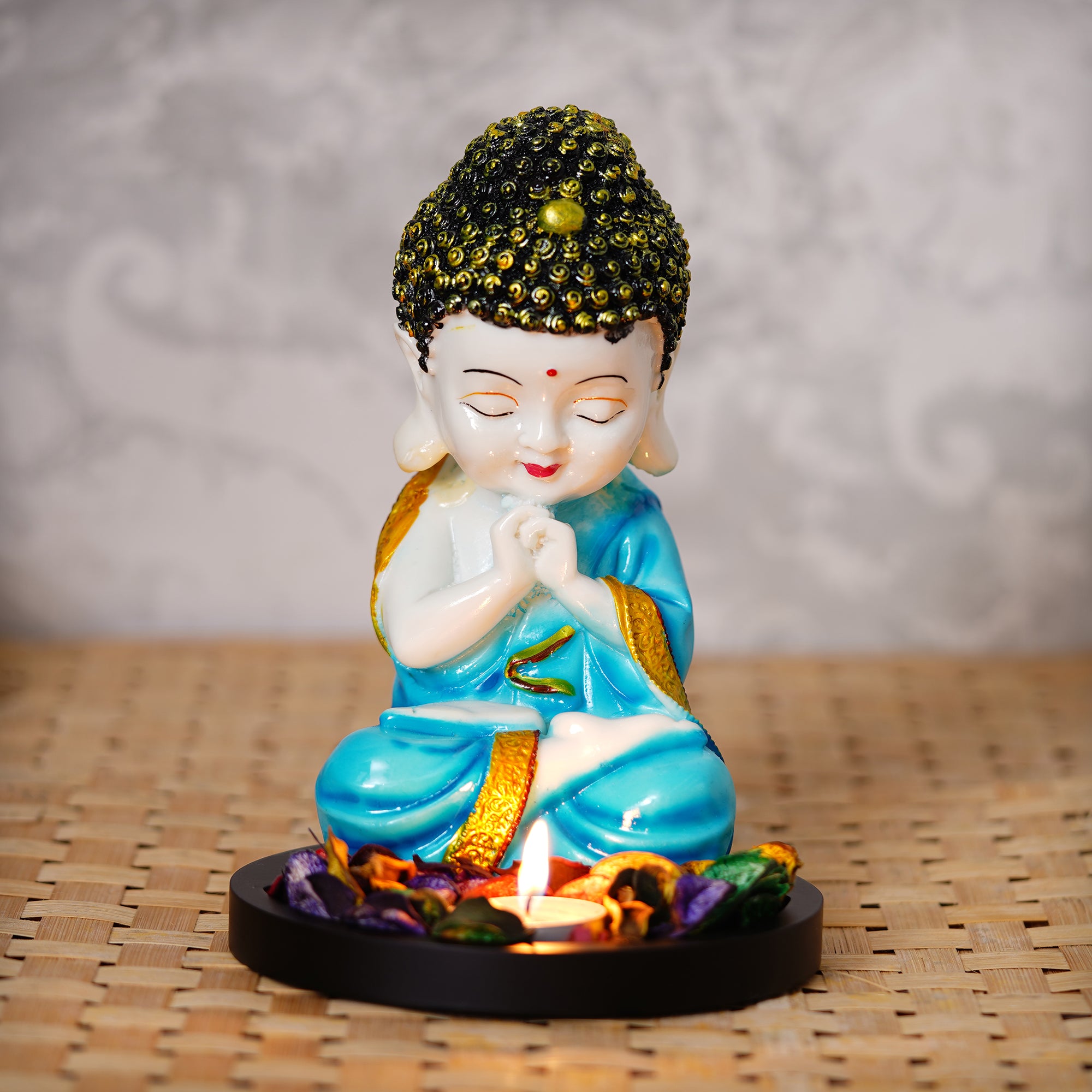 Polyresin Blue and White Praying Monk Buddha Statue with Wooden Base, Fragranced Petals and Tealight