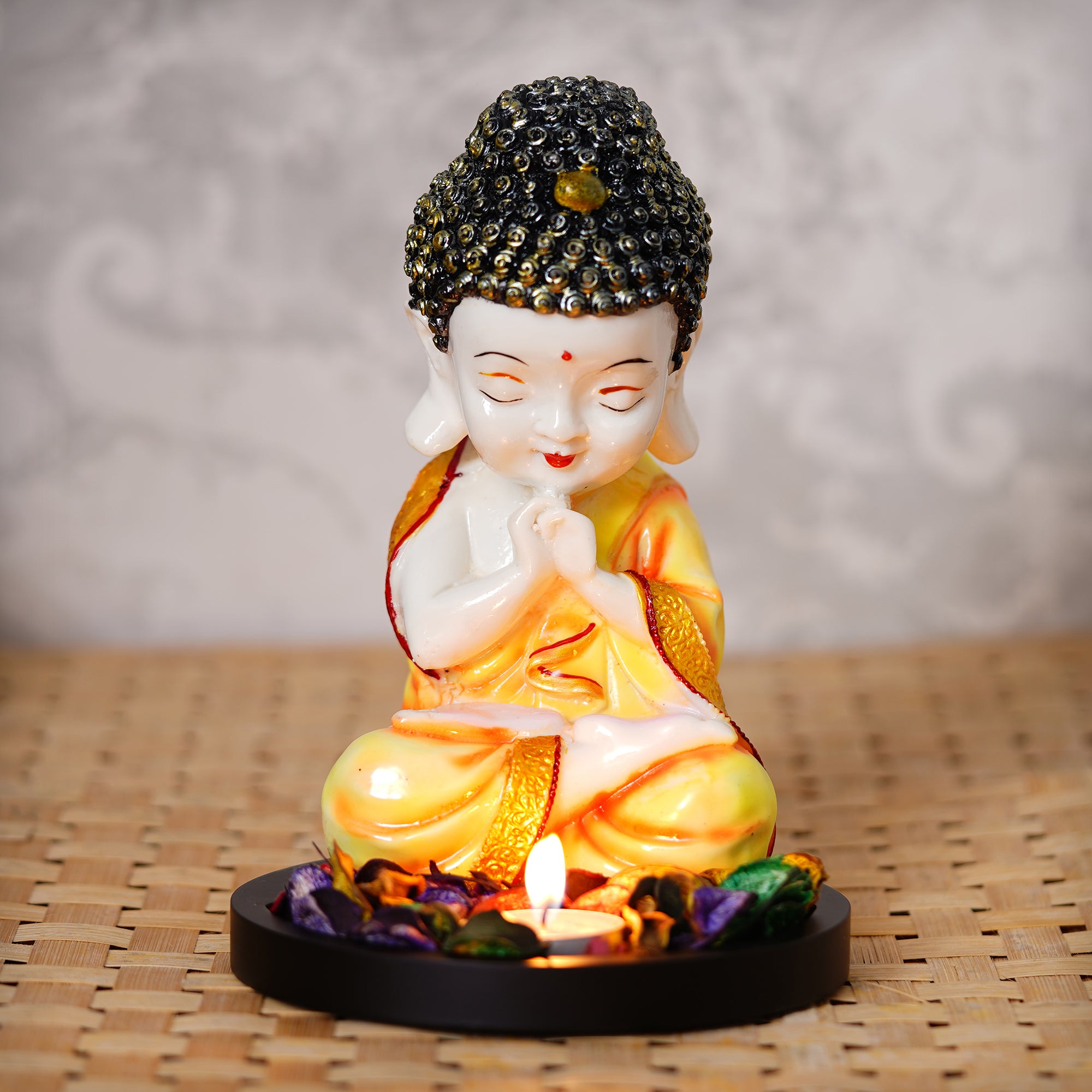 Polyresin Yellow and White Praying Monk Buddha Idol with Wooden Base, Fragranced Petals and Tealight