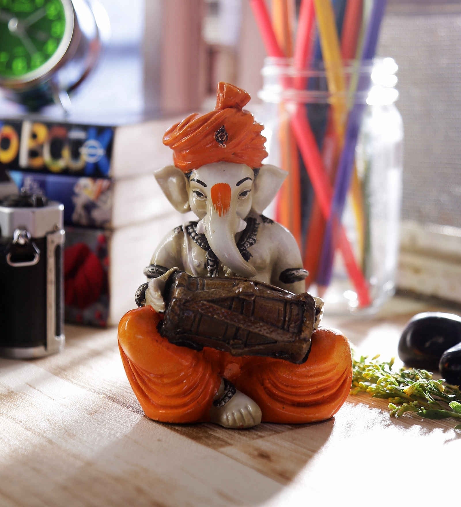 Orange Polyresin Lord Ganesha playing Dholak Idol