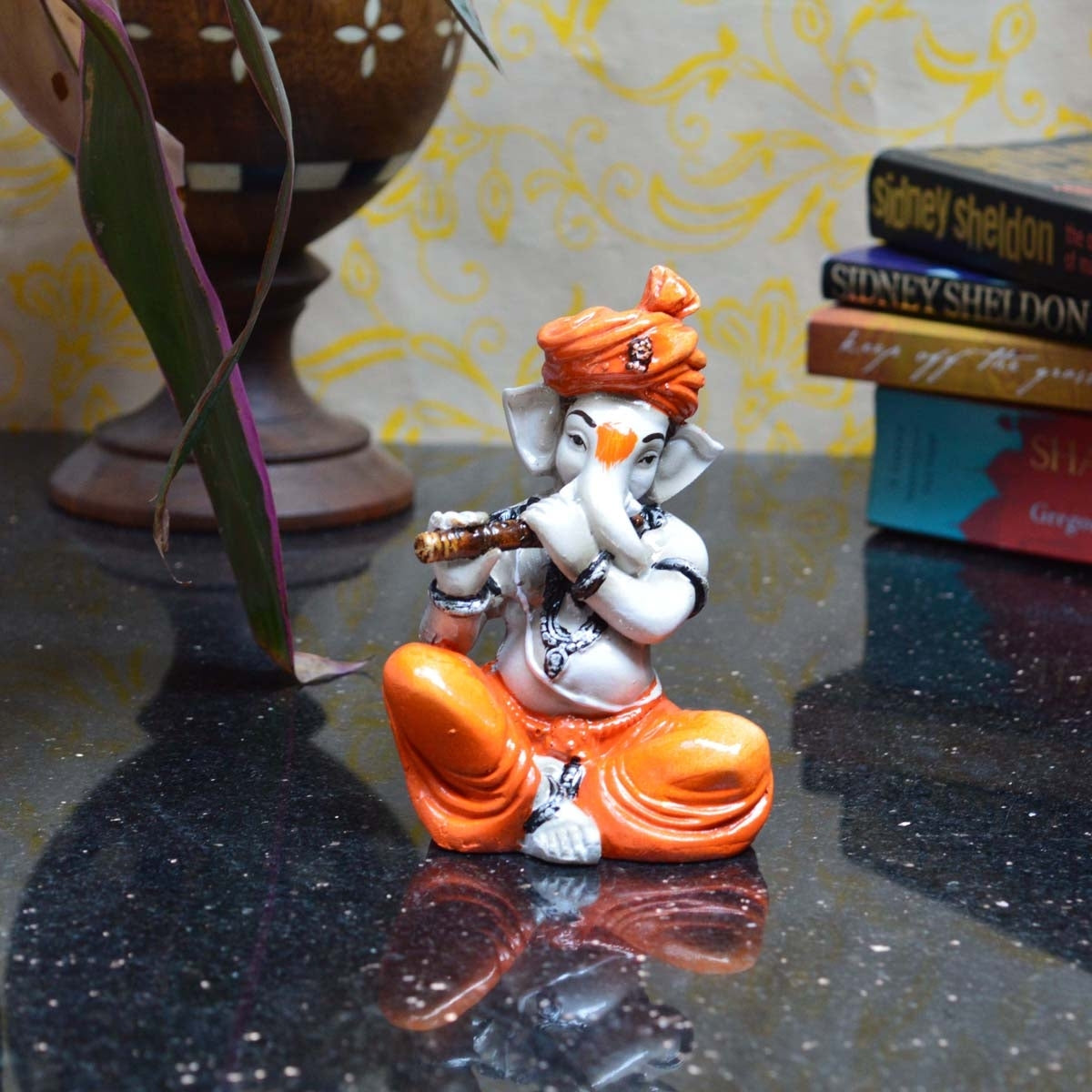 Orange Polyresin Lord Ganesha Playing Flute Idol 1