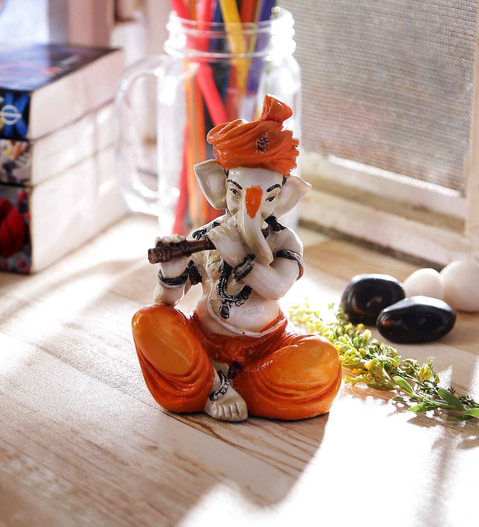 Orange Polyresin Lord Ganesha Playing Flute Idol