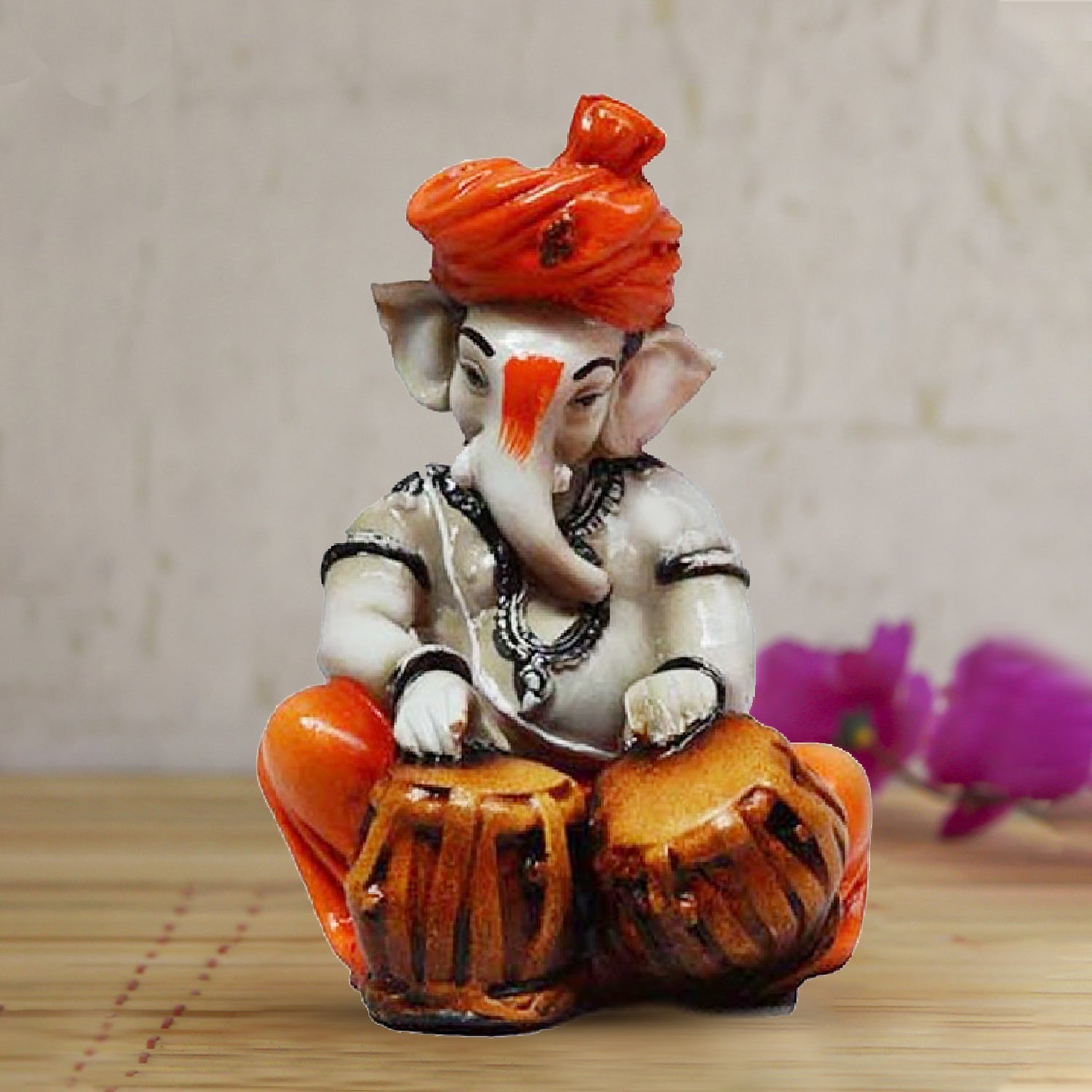Orange Polyresin Lord Ganesha Playing Tabla Idol