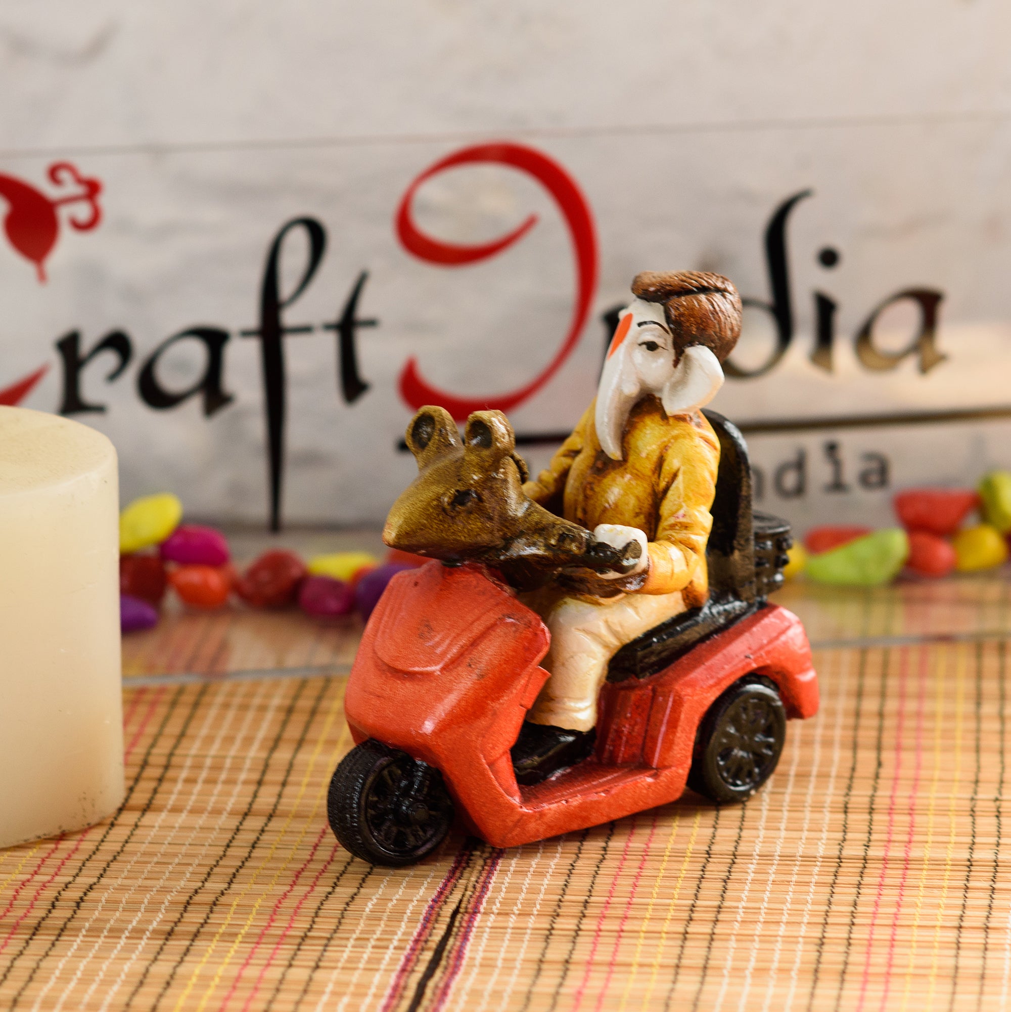 Polyresin Lord Ganesha Idol riding Scooter (Red and Yellow)
