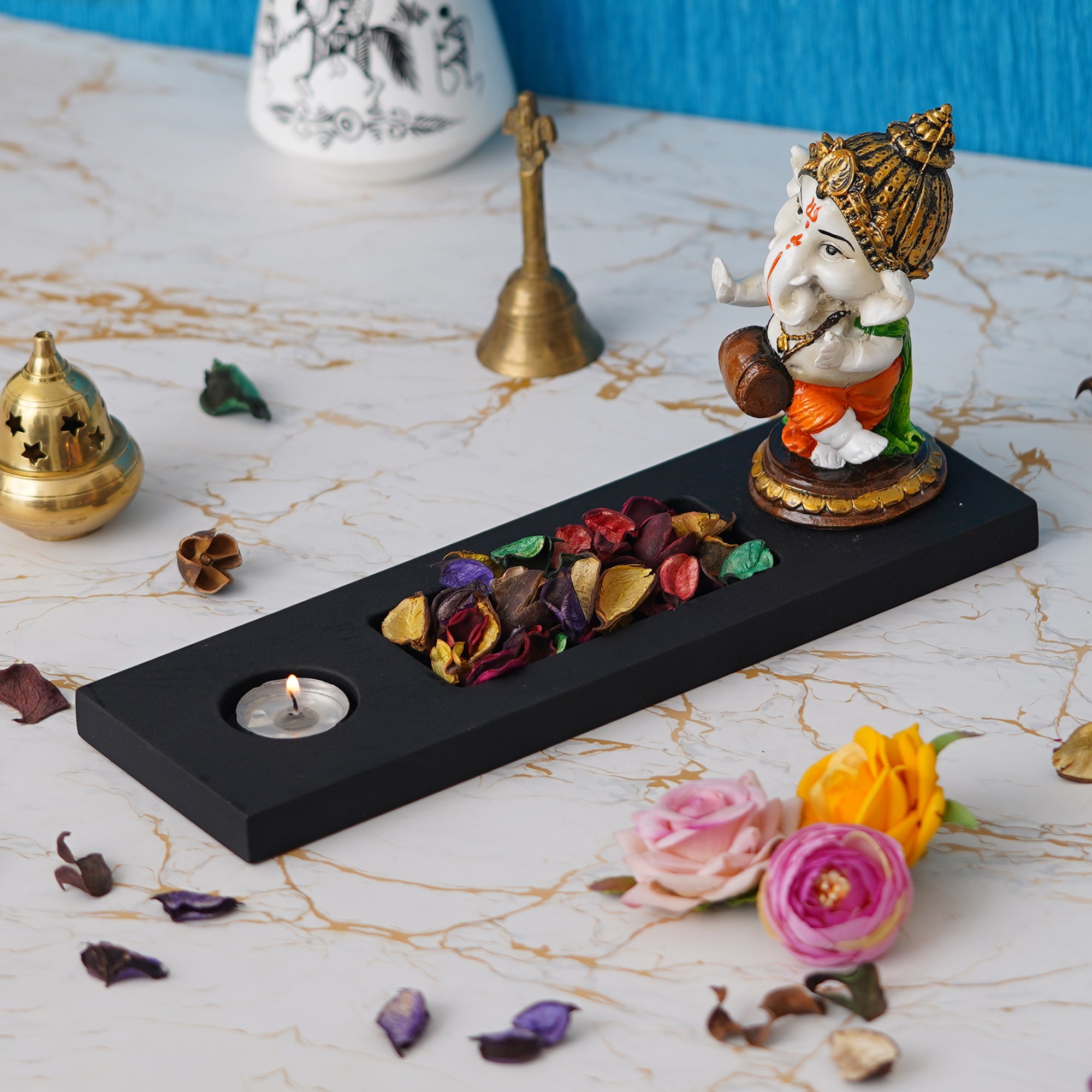 Orange, Brown, White & Black Polyresin Baal Ganesha Playing Dholak Showpiece with Rectangle Wooden Base, Fragranced Petals & Tealight 3