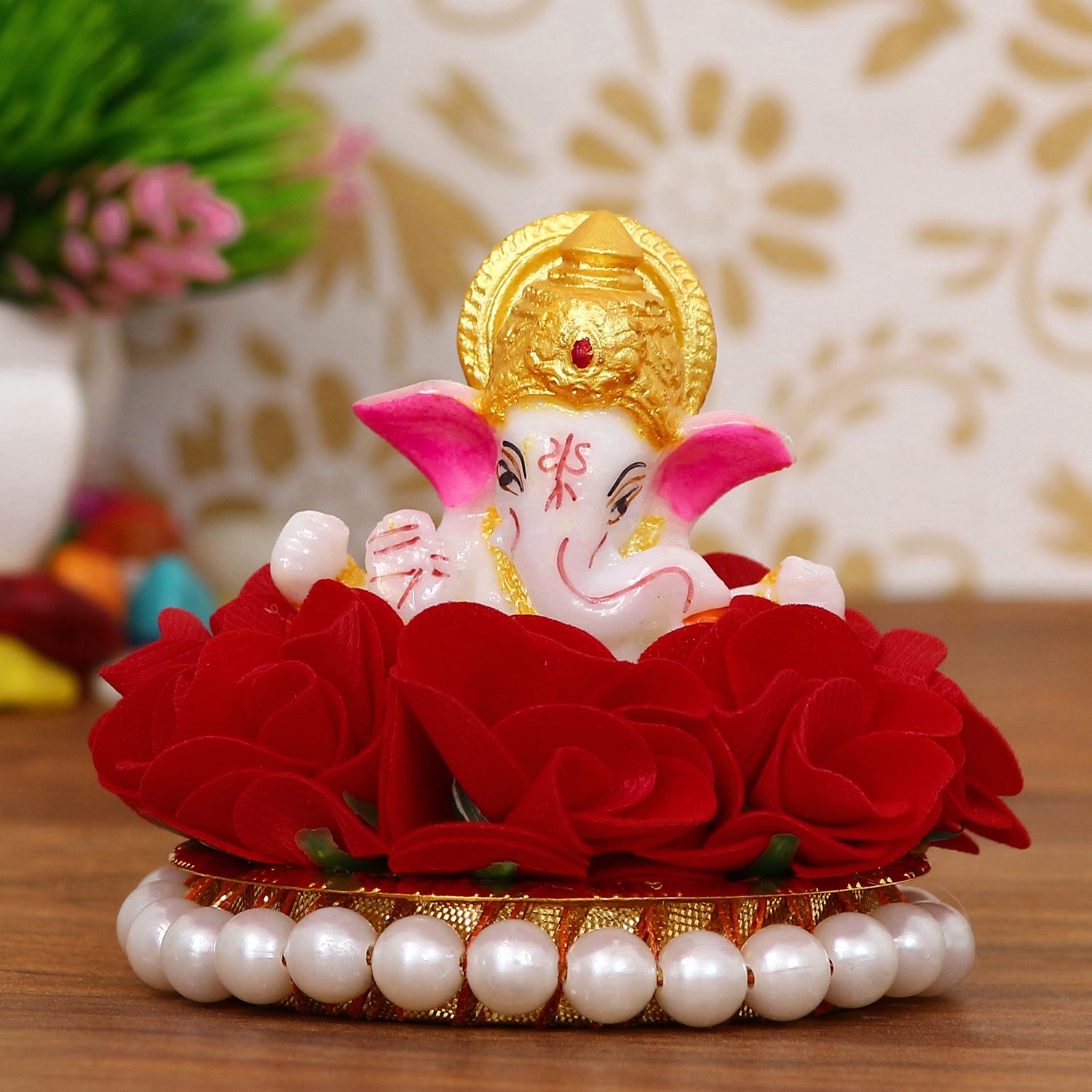 Lord Ganesha Idol on Decorative Handcrafted Plate with Red Flowers
