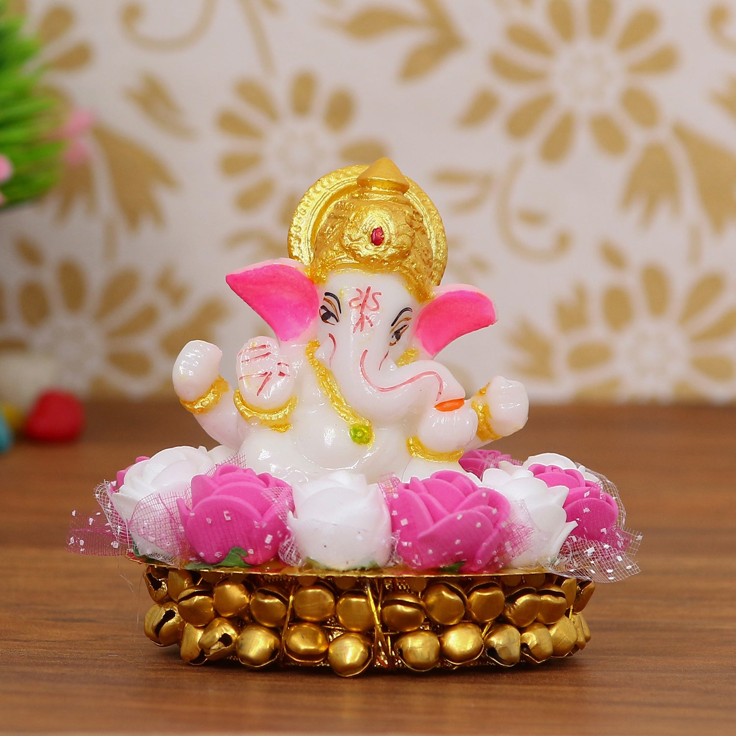 Golden and White Polyresin Lord Ganesha Idol on Decorative Handcrafted Plate with Pink and White Flowers