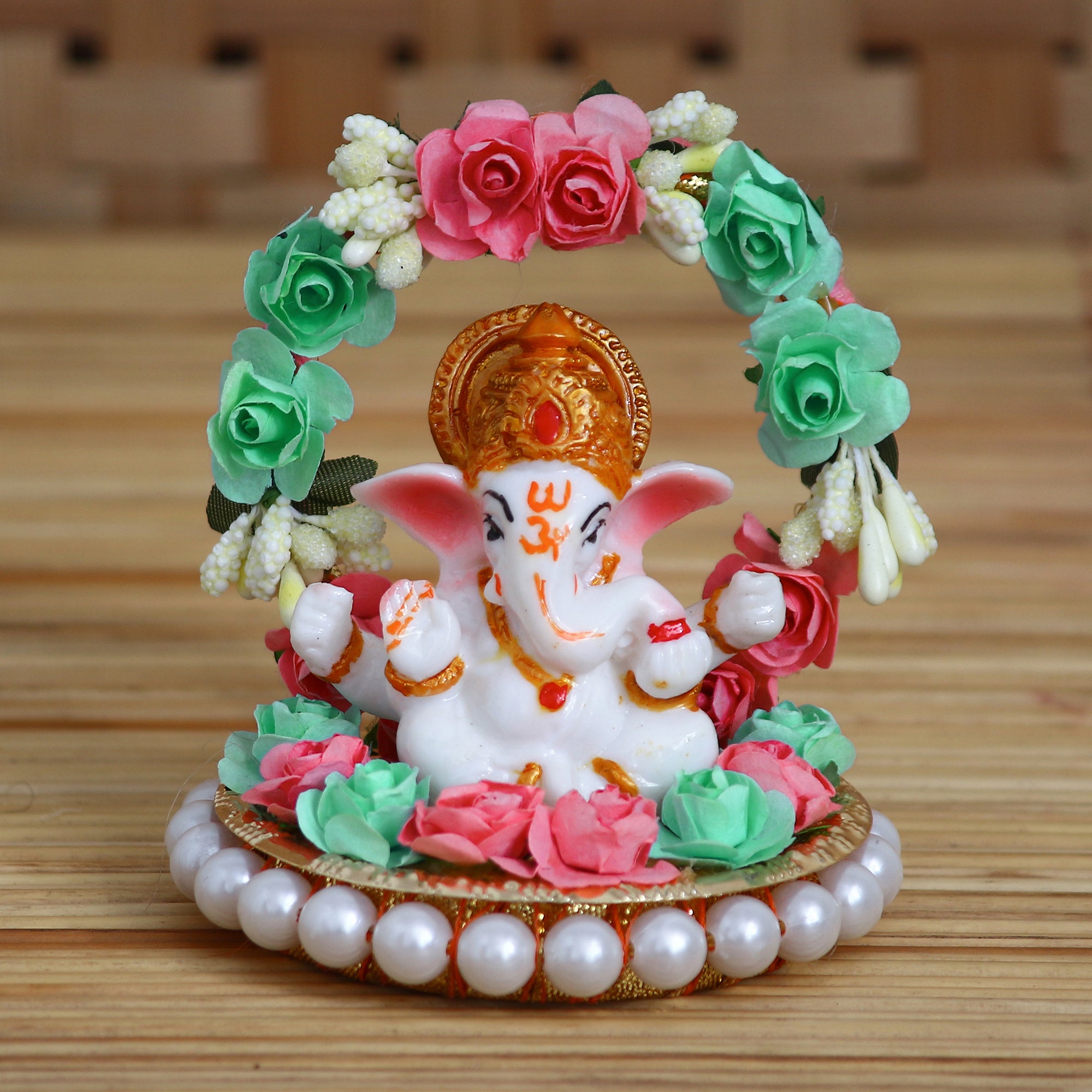 Lord Ganesha Idol On Decorative Handicrafted Plate With Throne Of Pink And Green Flowers