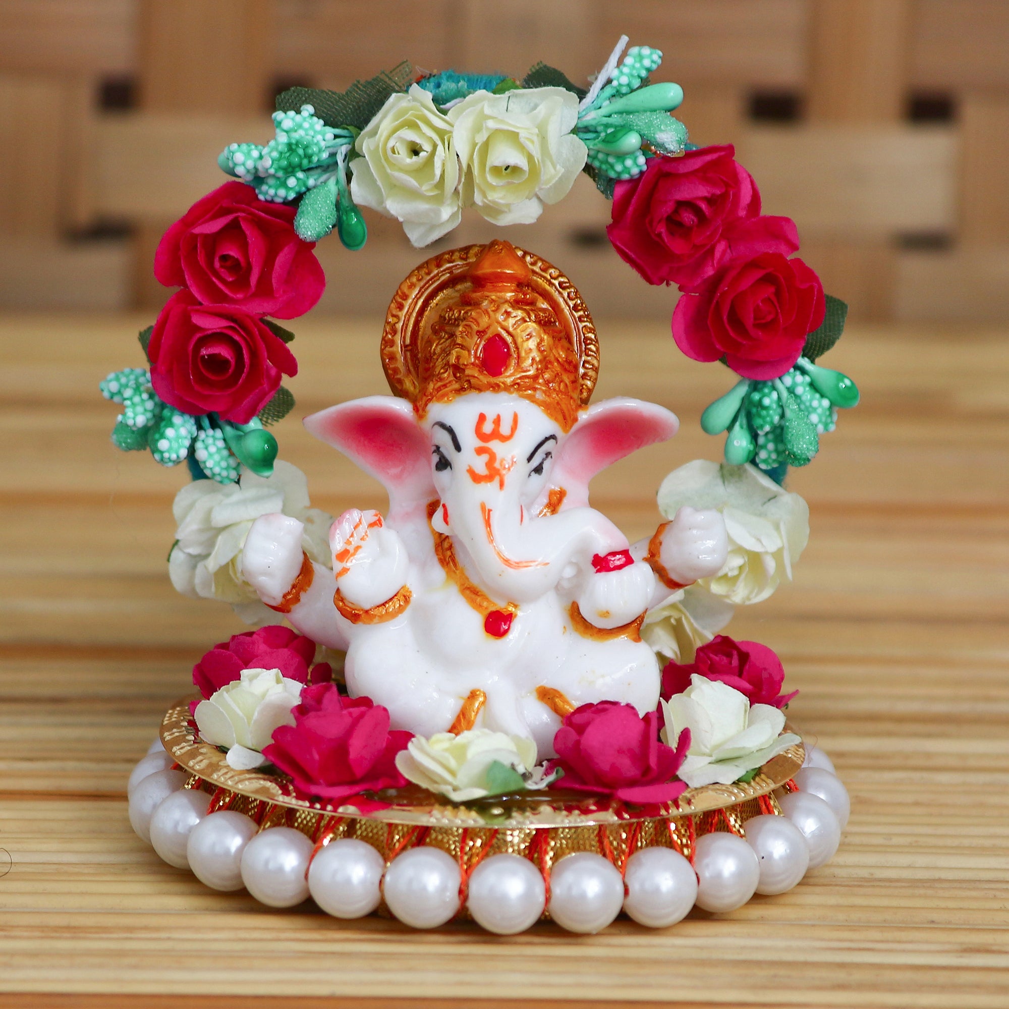 Polyresin Lord Ganesha Idol on Decorative Handcrafted Plate with Throne of Colorful Flowers