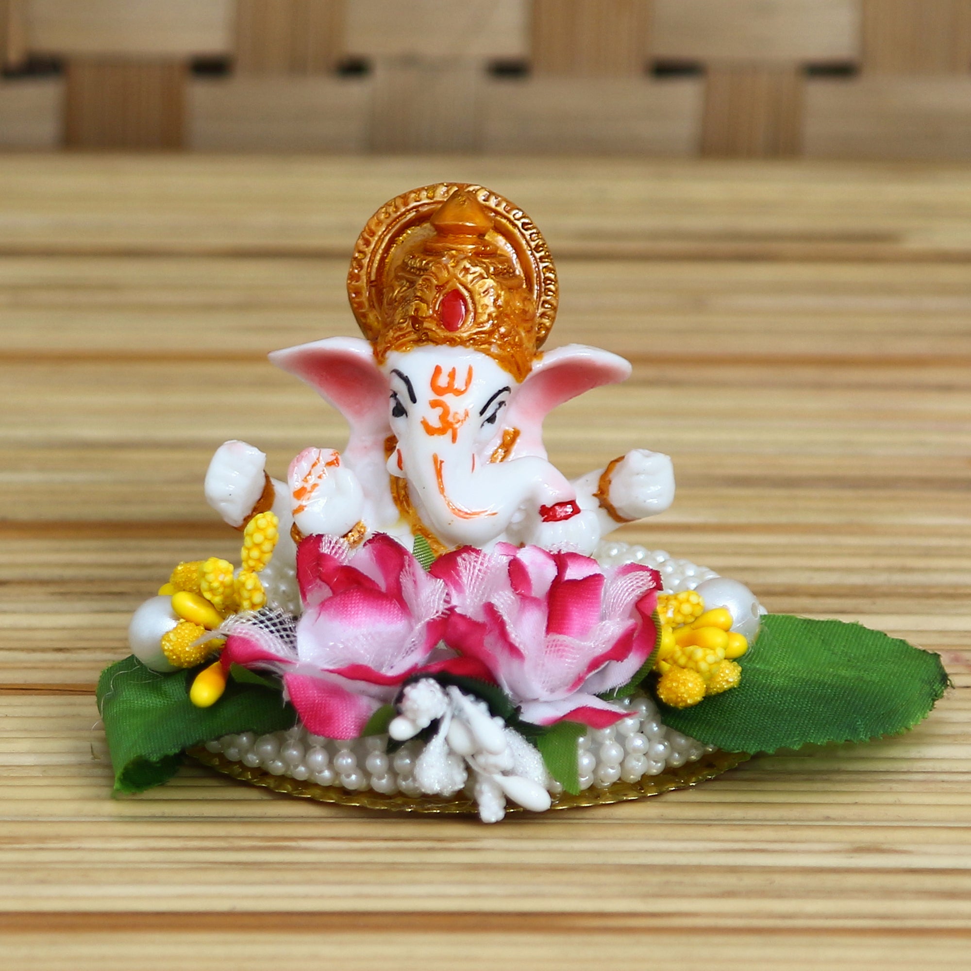 Lord Ganesha Idol on Decorative Handcrafted Plate with Colorful Flowers and Leaf