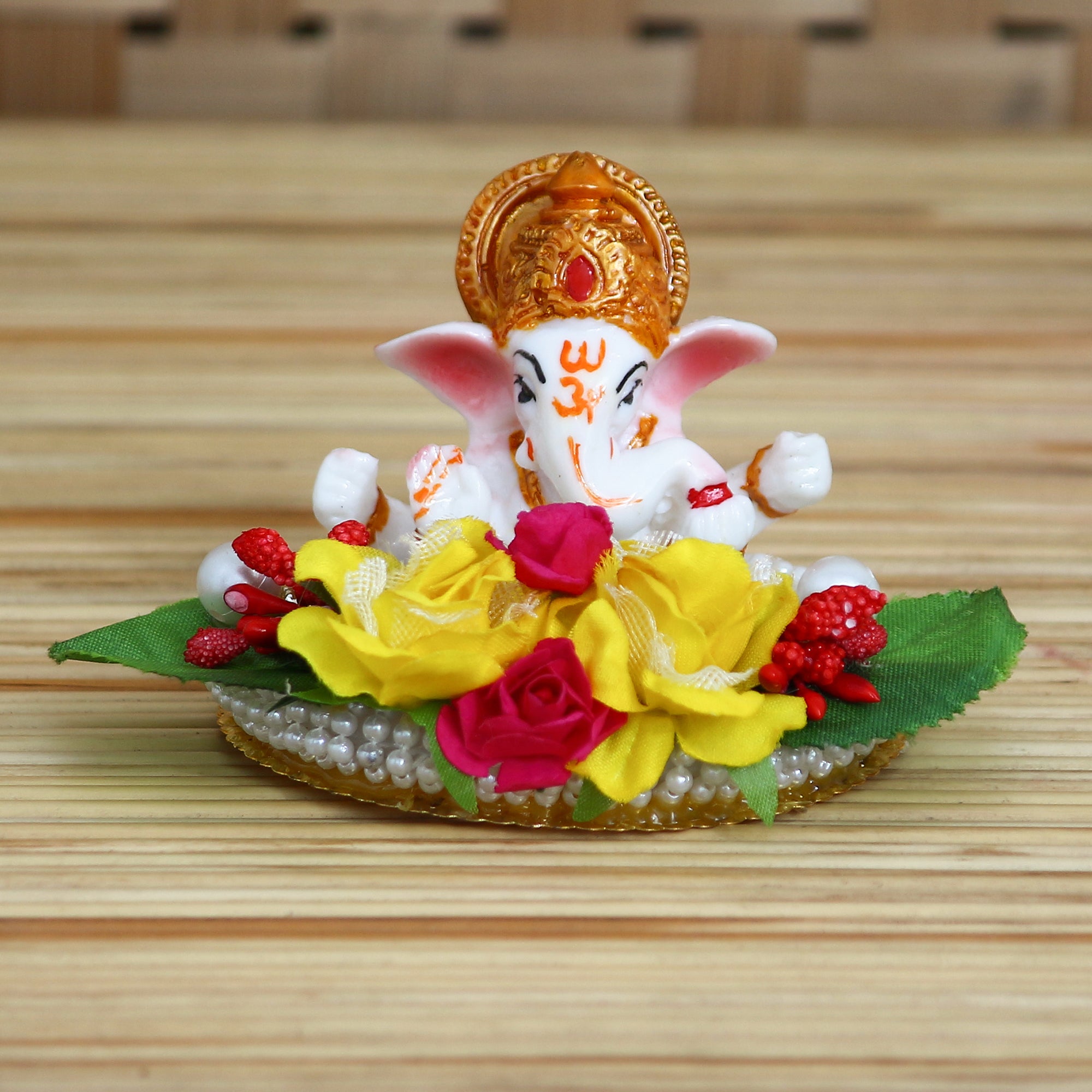 Lord Ganesha Idol on Decorative Handcrafted Plate with Colorful Flowers and Leaf