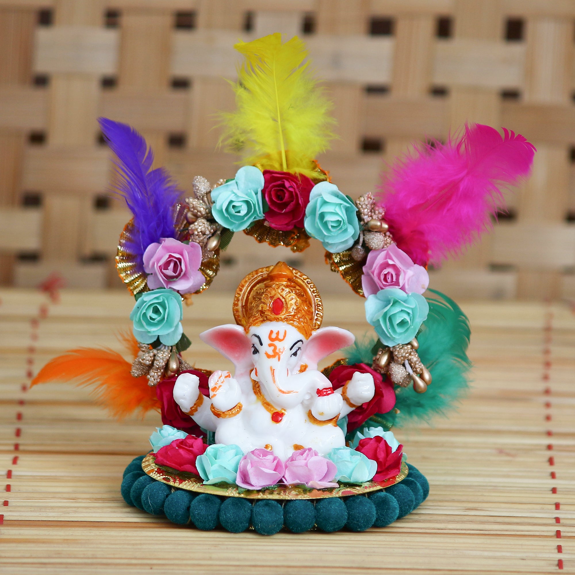 Lord Ganesha Idol On Decorative Handcrafted Plate With Throne Of Colorful Flowers And Feathers