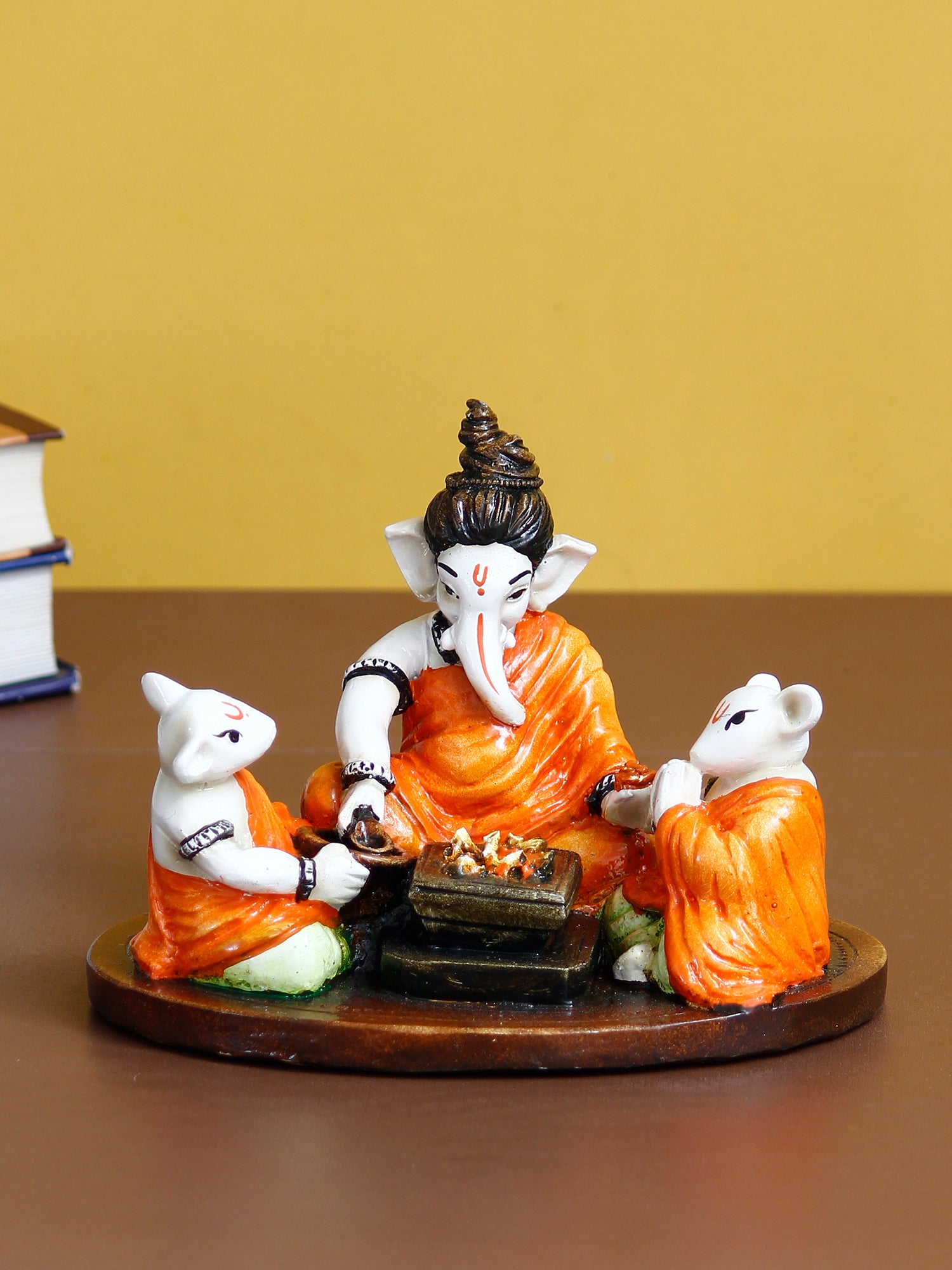 Orange and White Polyresin Handcrafted Lord Ganesha Idol Doing Havan with 2 Mushaks