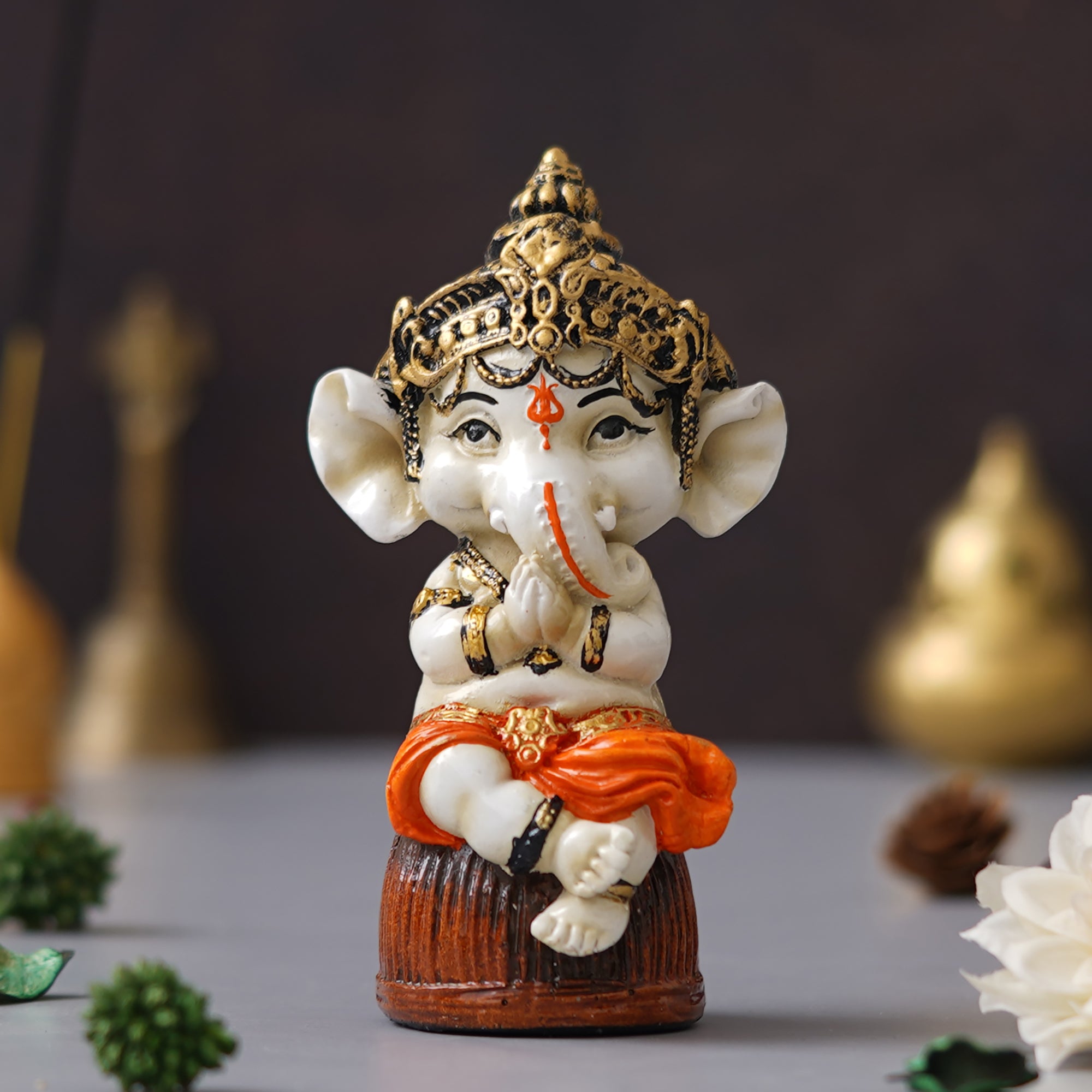 eCraftIndia Orange Polyresin Handcrafted Lord Ganesha Idol Sitting on Rock 4