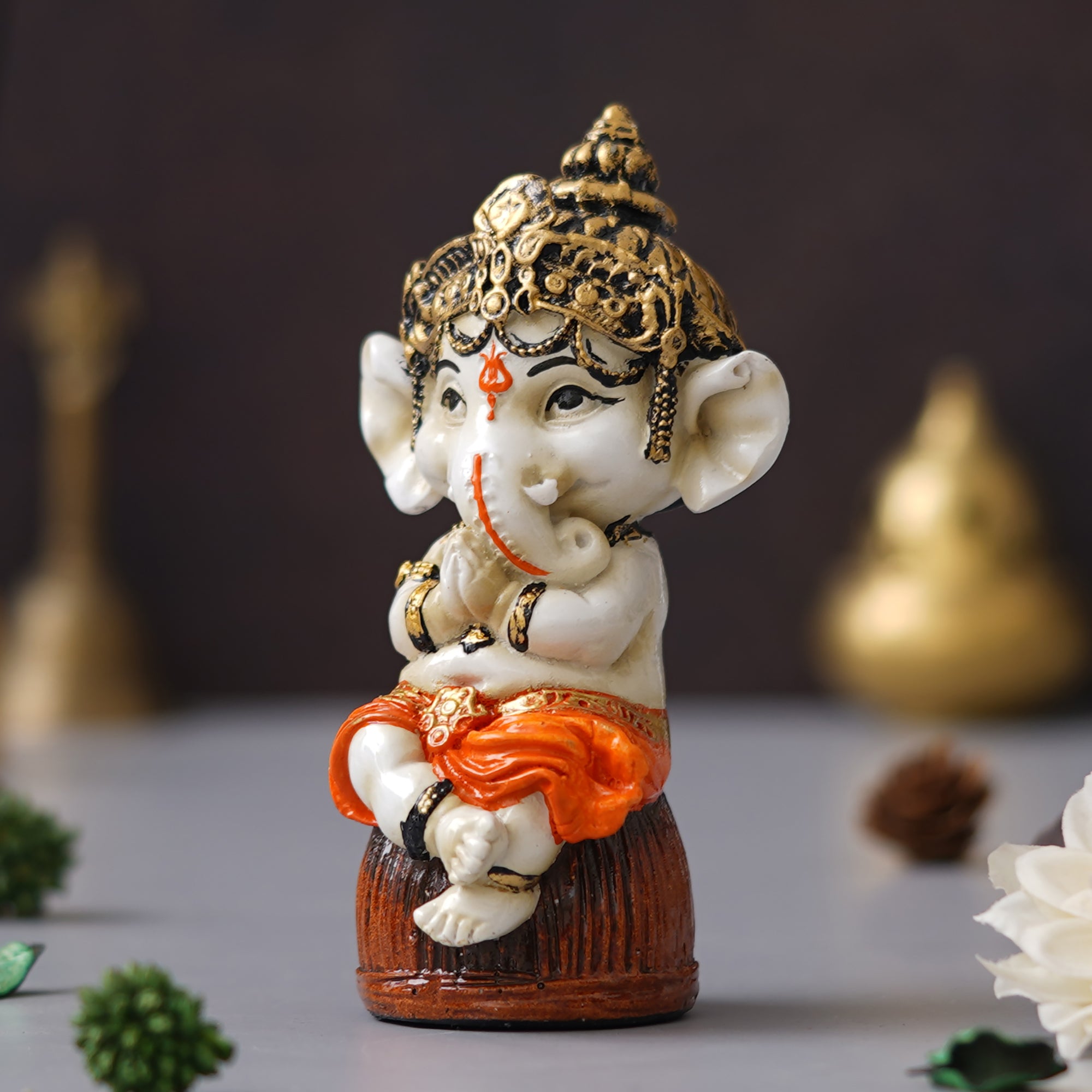 eCraftIndia Orange Polyresin Handcrafted Lord Ganesha Idol Sitting on Rock 5