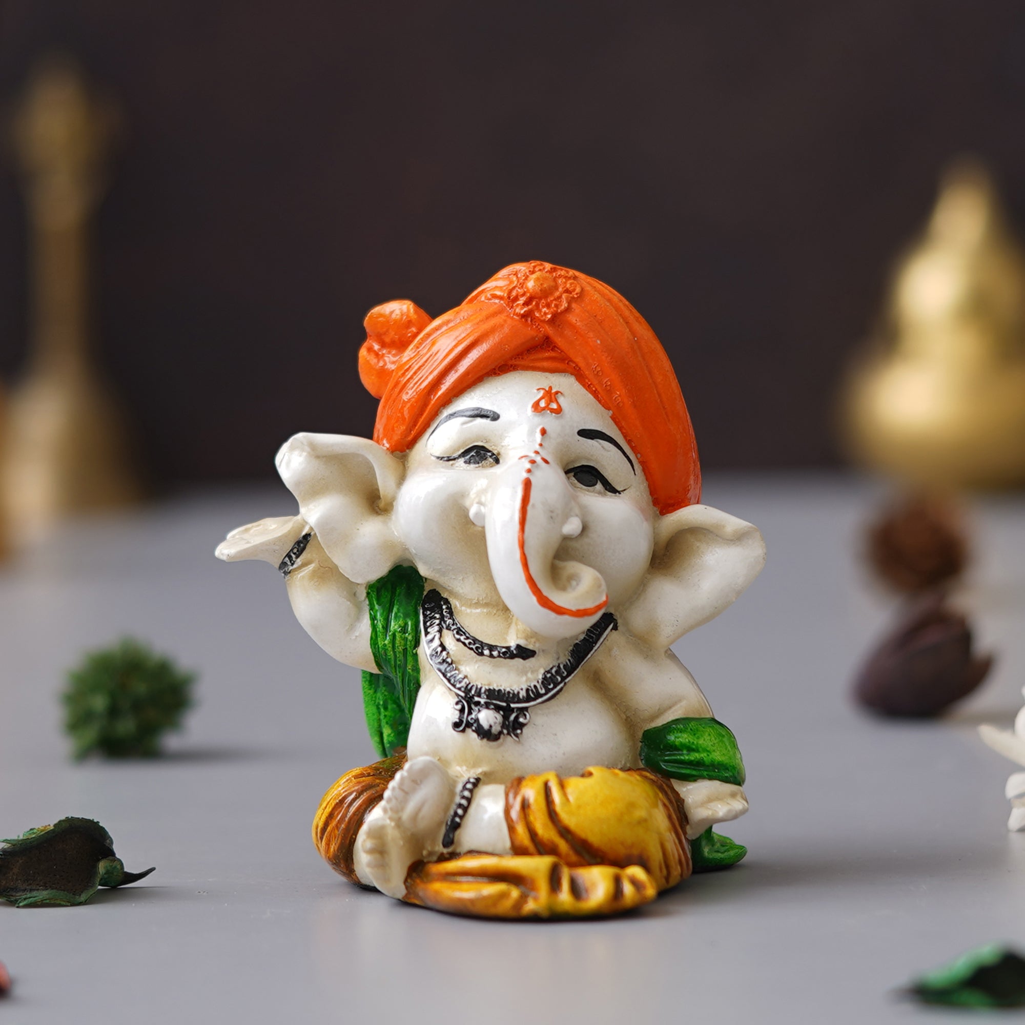 eCraftIndia Orange Polyresin Handcrafted Dancing Lord Ganesha Idol while Sitting 4