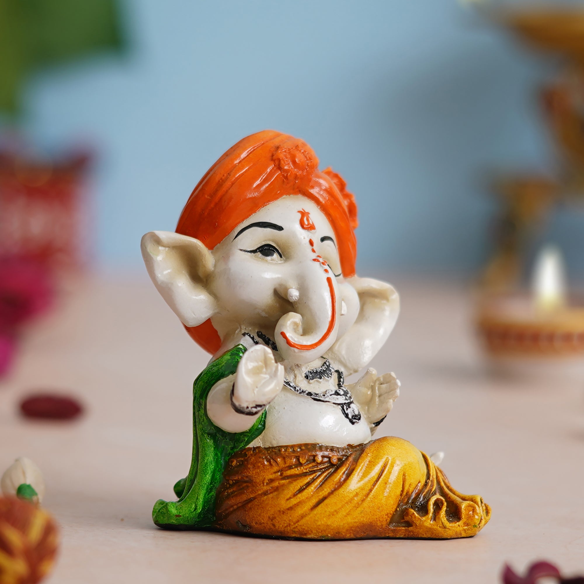 eCraftIndia Orange Polyresin Handcrafted Dancing Lord Ganesha Idol while Sitting 1