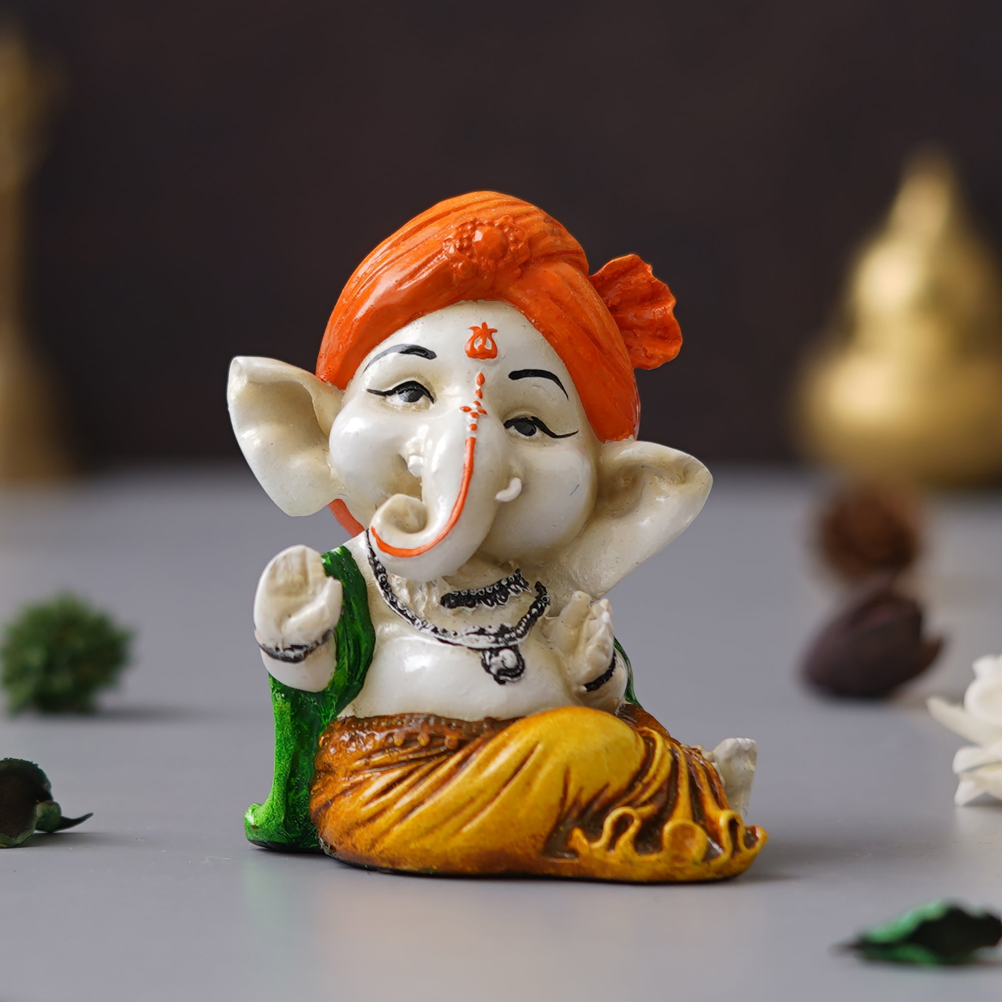 eCraftIndia Orange Polyresin Handcrafted Dancing Lord Ganesha Idol while Sitting 4