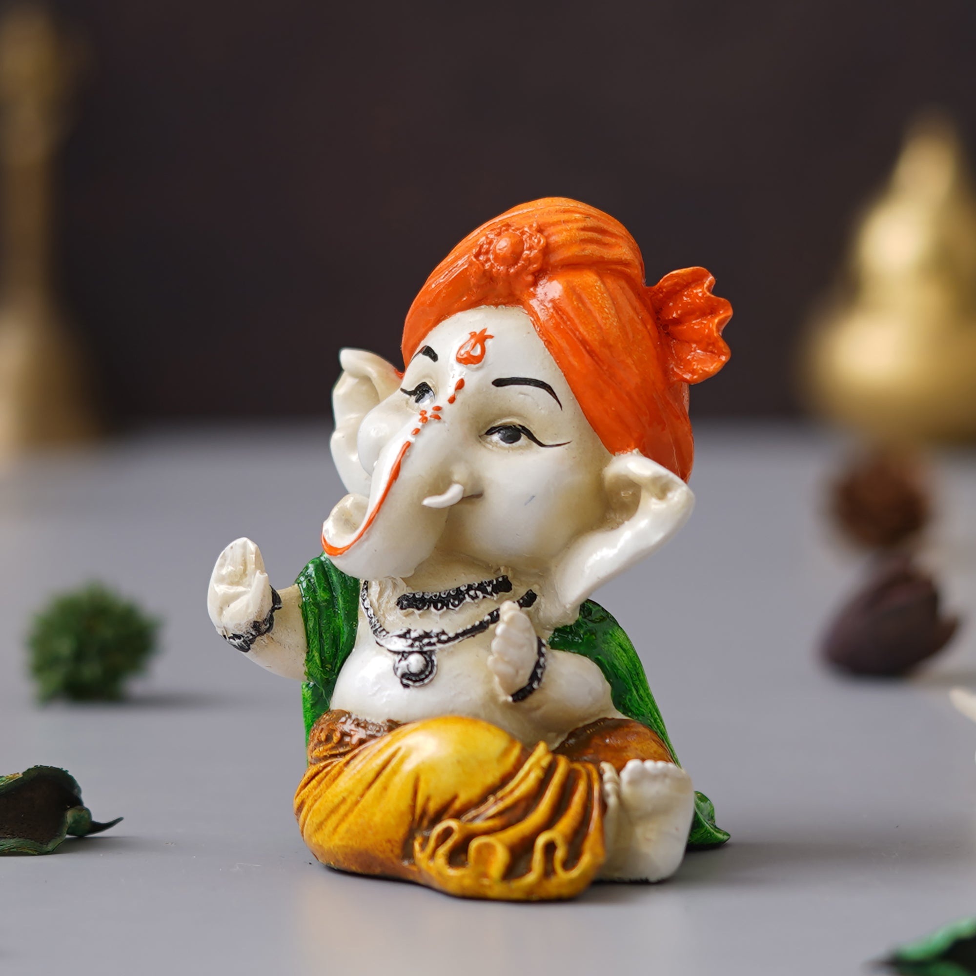 eCraftIndia Orange Polyresin Handcrafted Dancing Lord Ganesha Idol while Sitting 5
