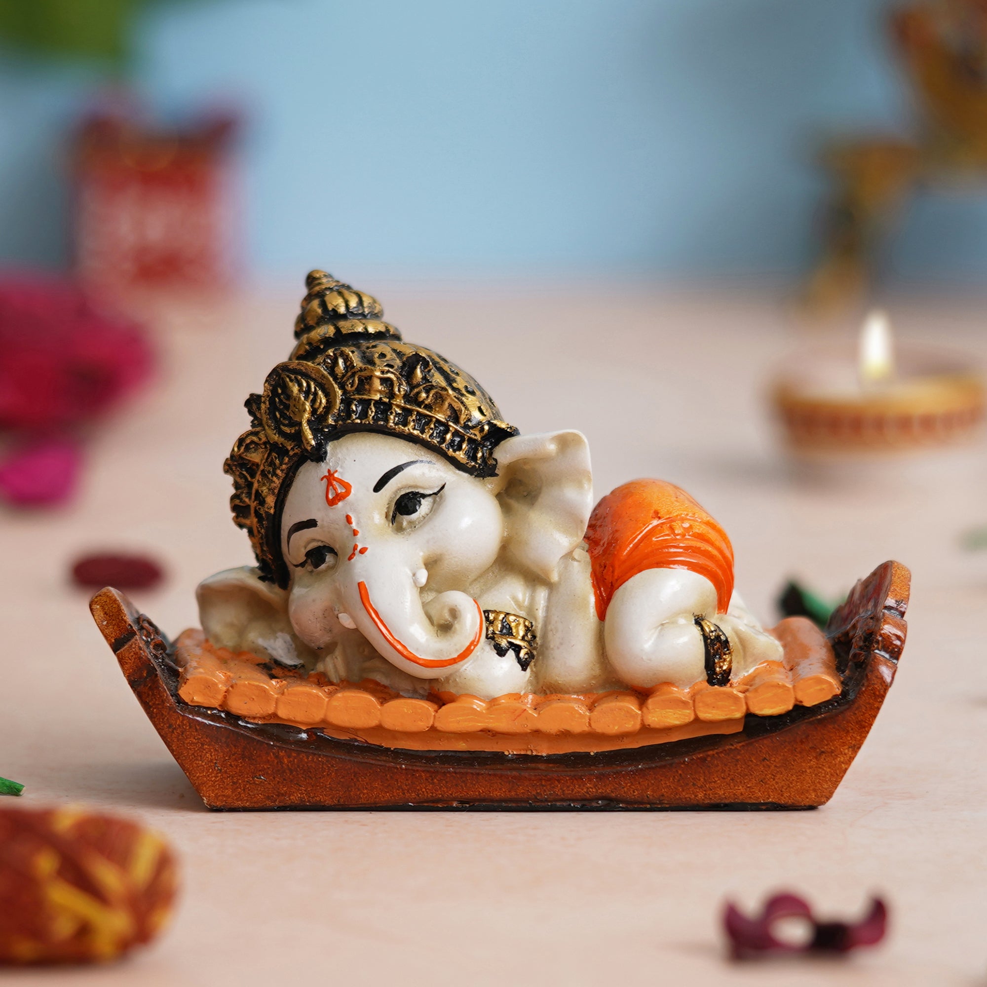 eCraftIndia Orange Handcrafted Polyresin Decorated Lord Ganesha Idol Sitting on Musical Instrument 1