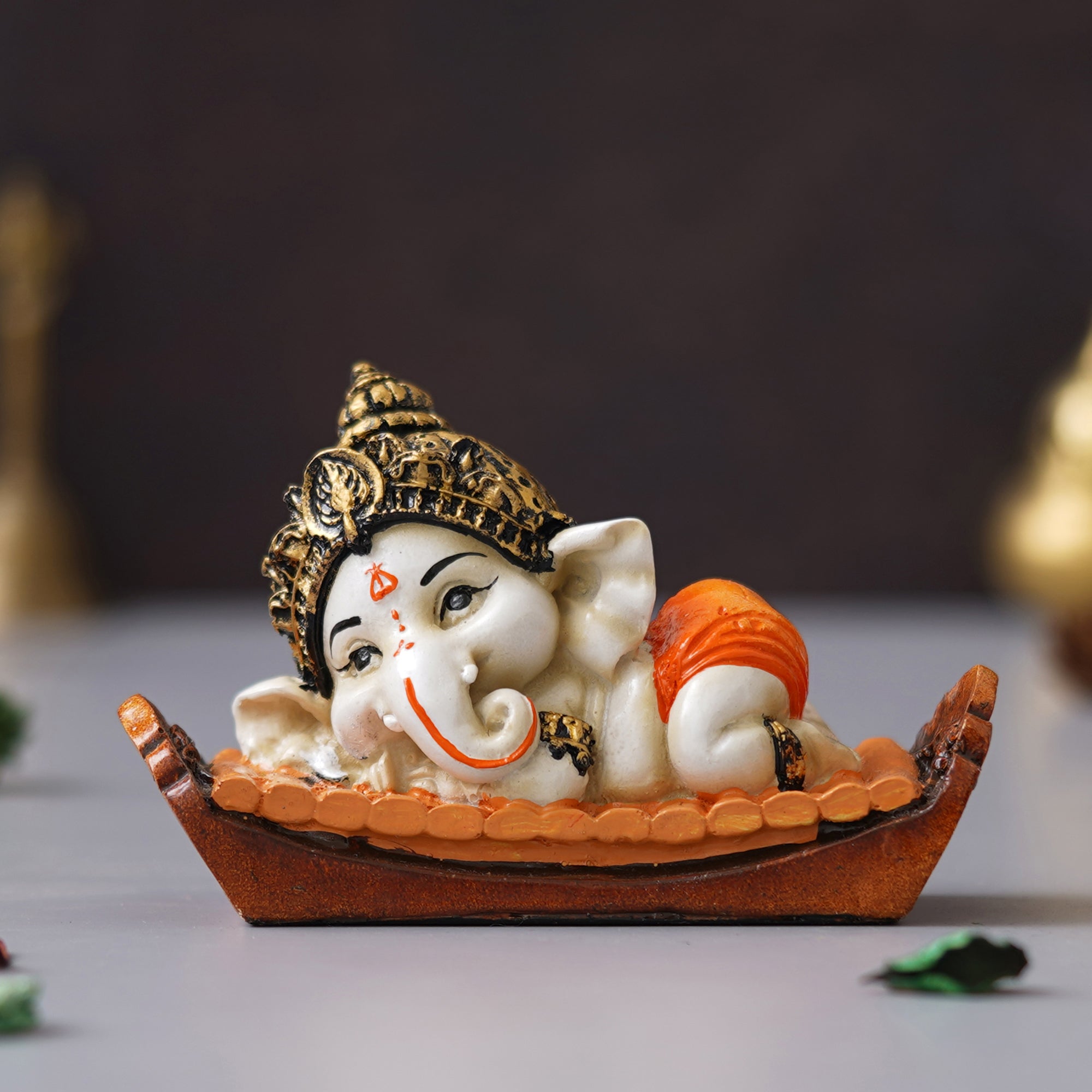 eCraftIndia Orange Handcrafted Polyresin Decorated Lord Ganesha Idol Sitting on Musical Instrument 4