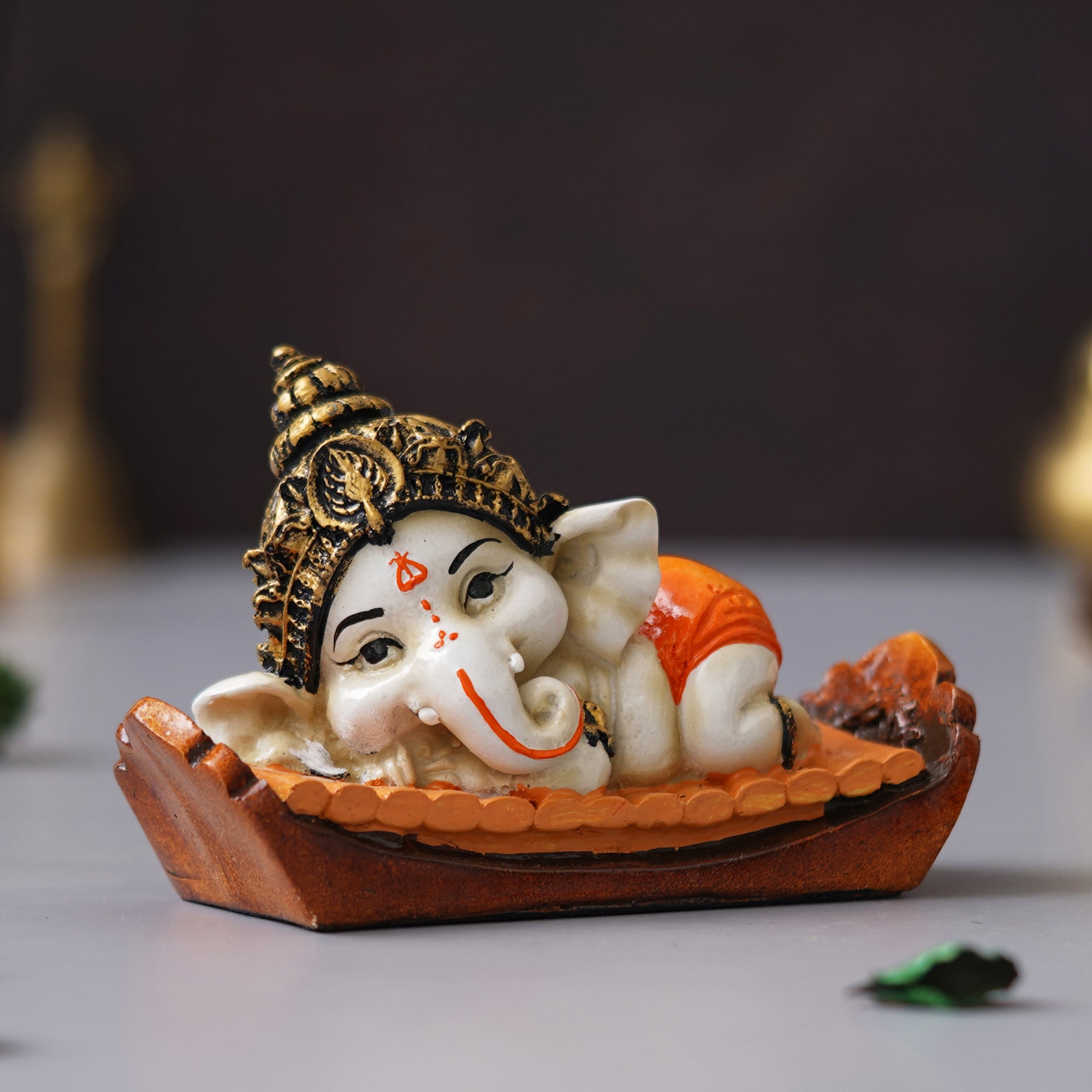 eCraftIndia Orange Handcrafted Polyresin Decorated Lord Ganesha Idol Sitting on Musical Instrument 5