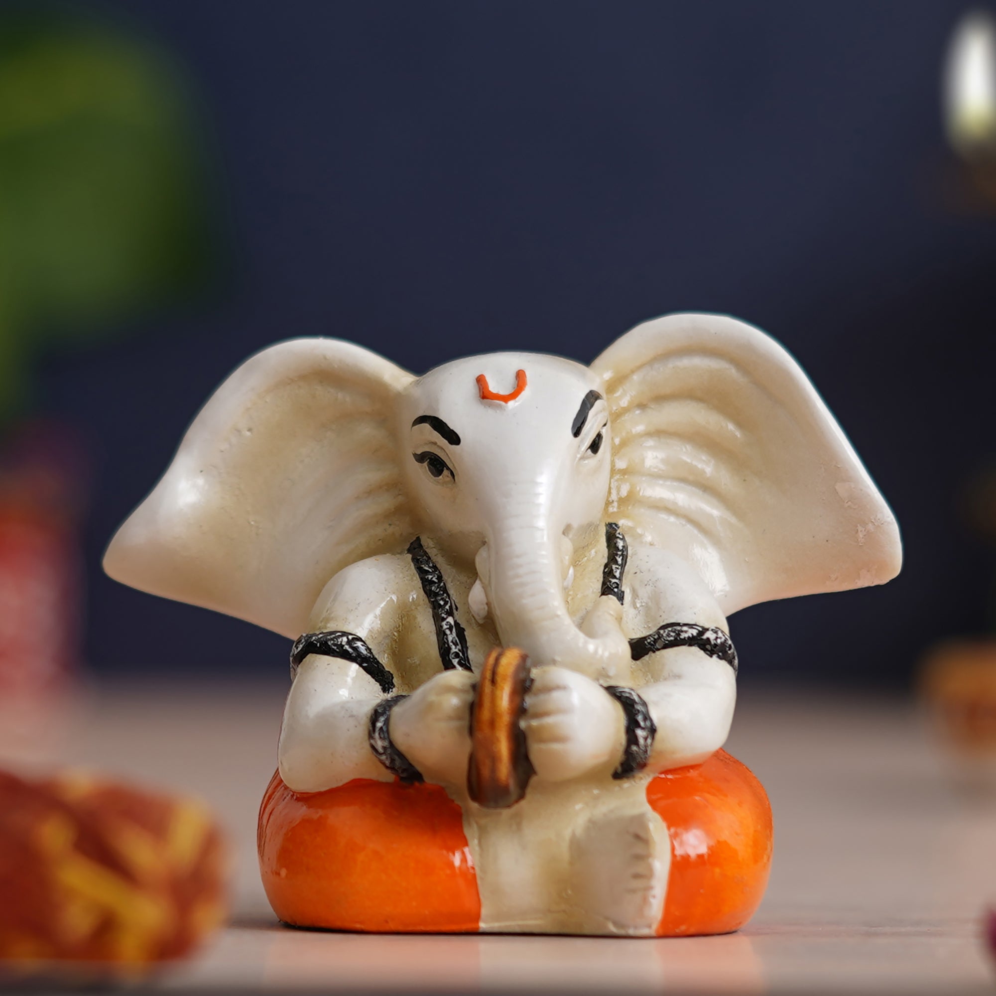 eCraftIndia White & Orange Polyresin Lord Ganesha Idol Playing Cymbals Musical Instrument