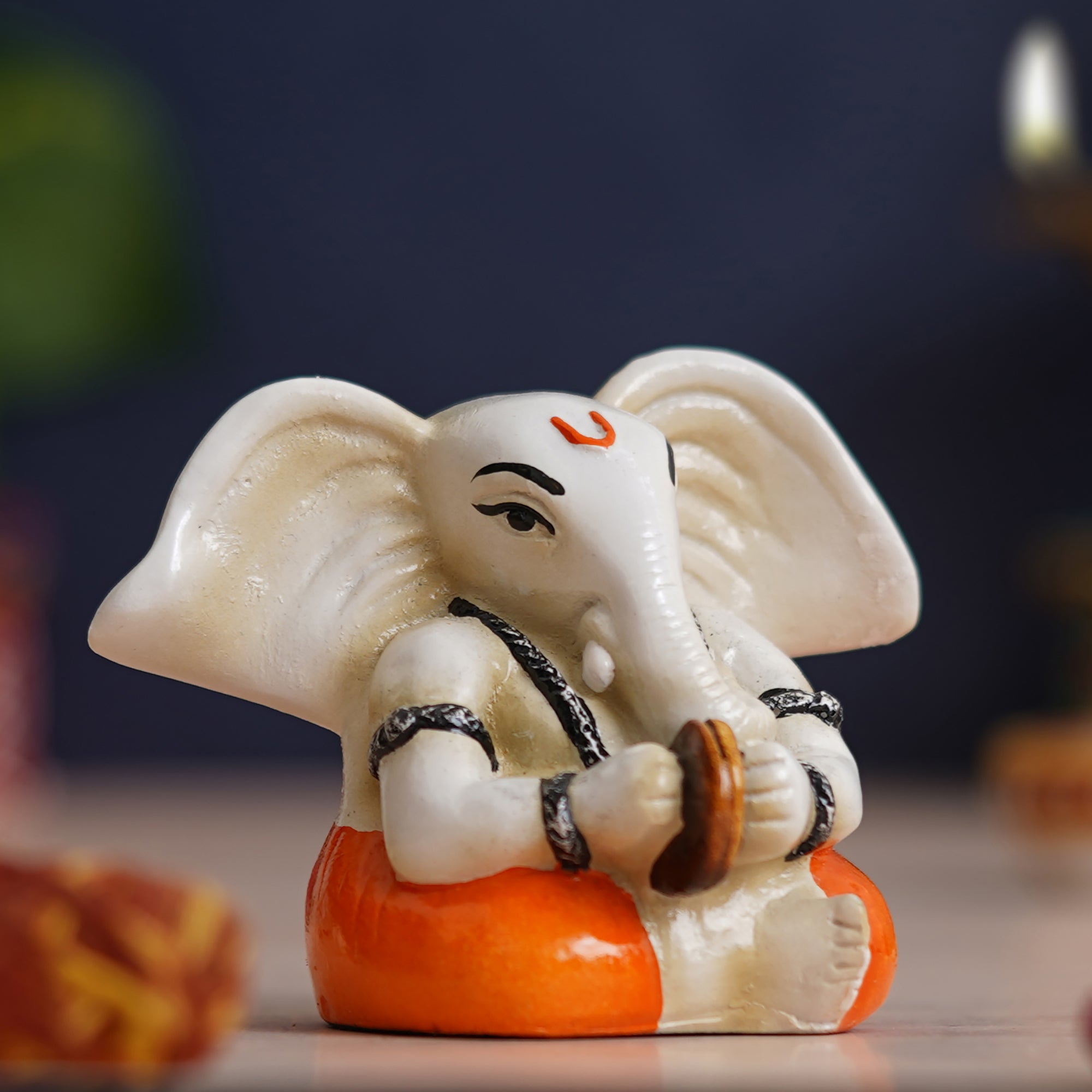 eCraftIndia White & Orange Polyresin Lord Ganesha Idol Playing Cymbals Musical Instrument 1