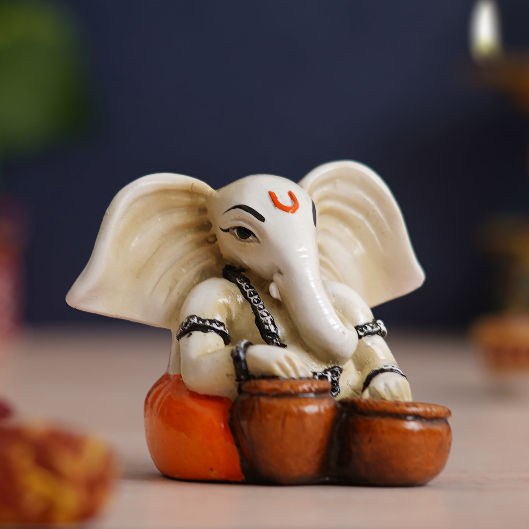 eCraftIndia White & Orange Polyresin Handcrafted Lord Ganesha Idol Playing Tabla Musical Instrument 1