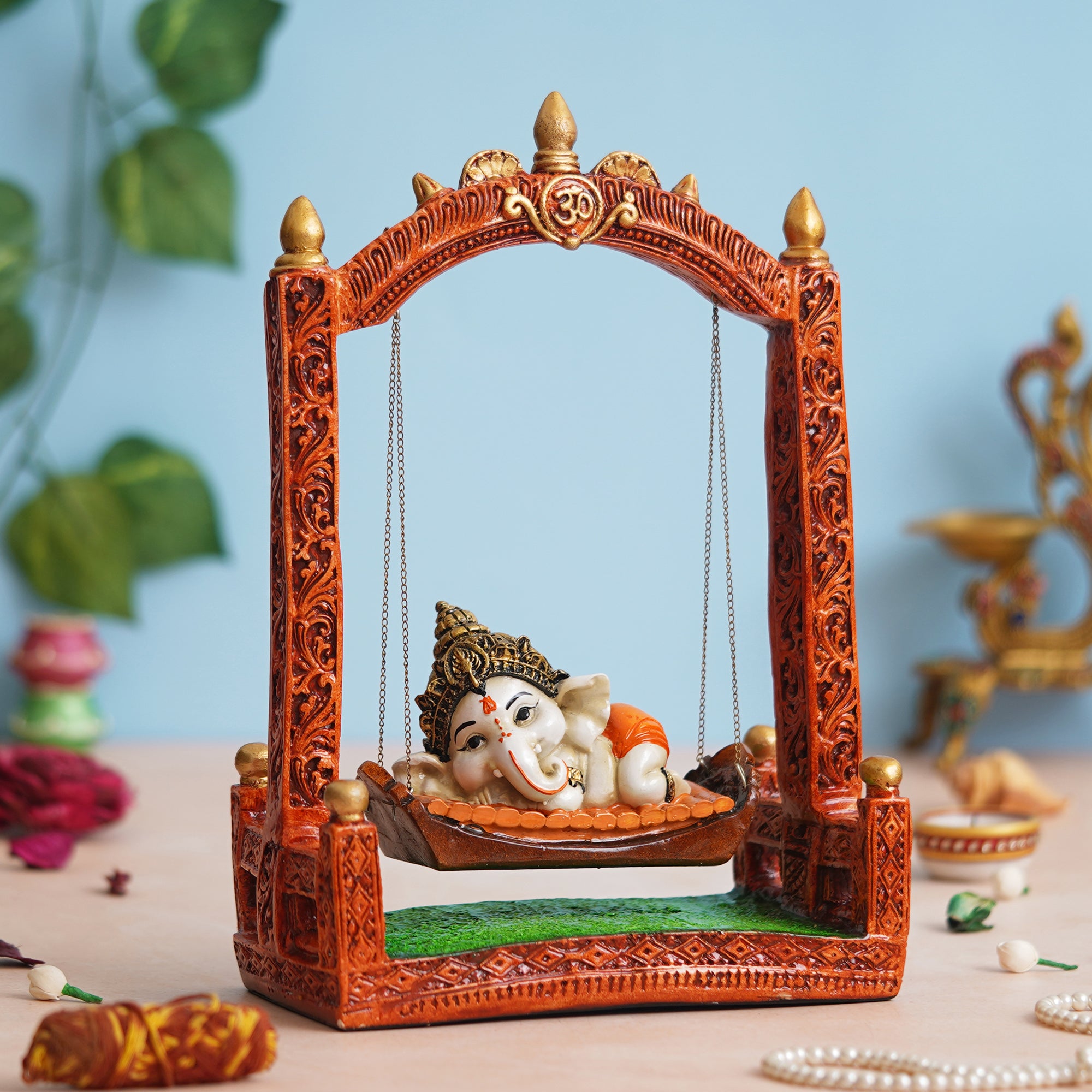 eCraftIndia Multicolor Polyresin Lord Ganesha Idol Resting On A Swing Decorative Showpiece 1