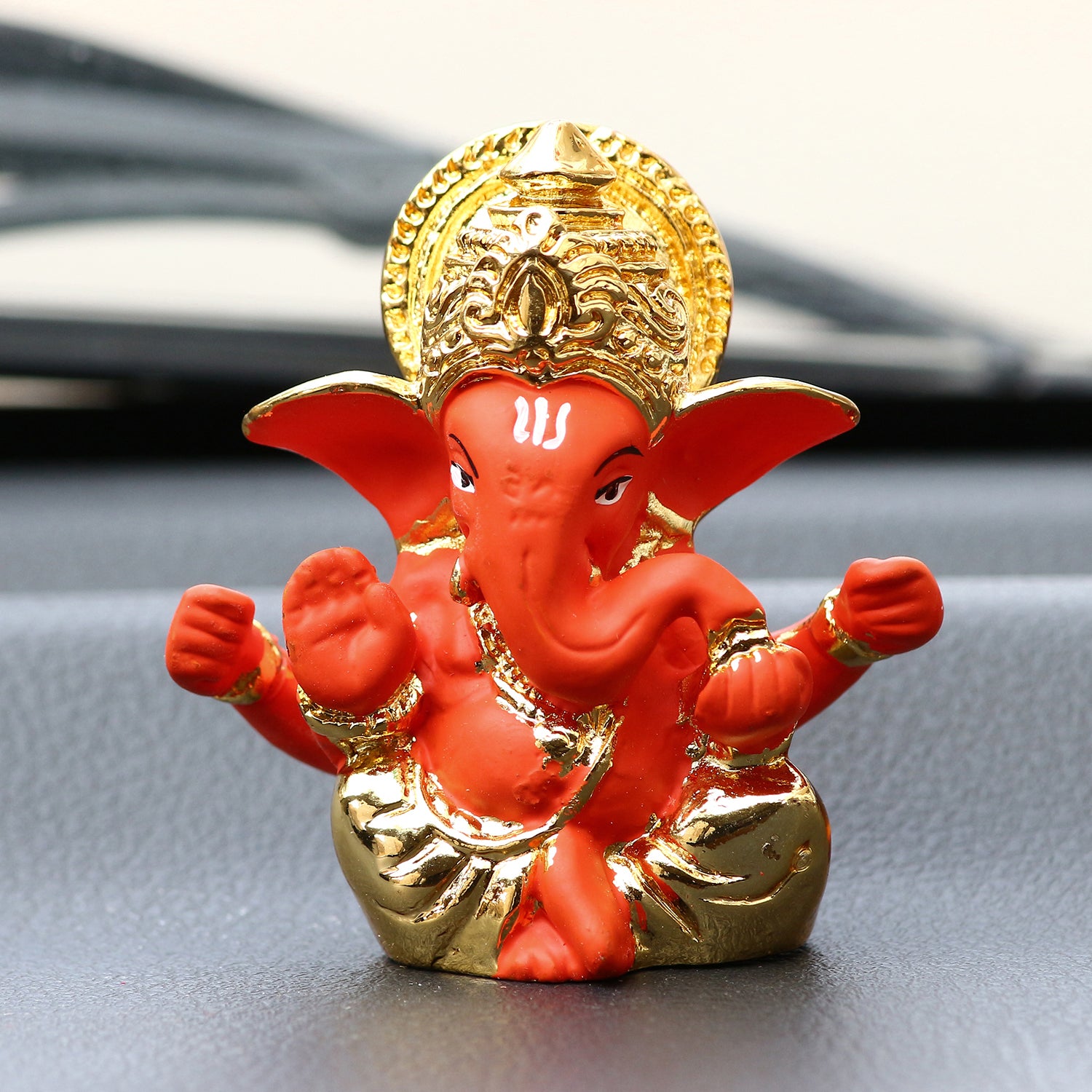 Gold Plated Orange Polyresin Lord Ganesha Idol for Home, Temple, Office and Car Dashboard 1