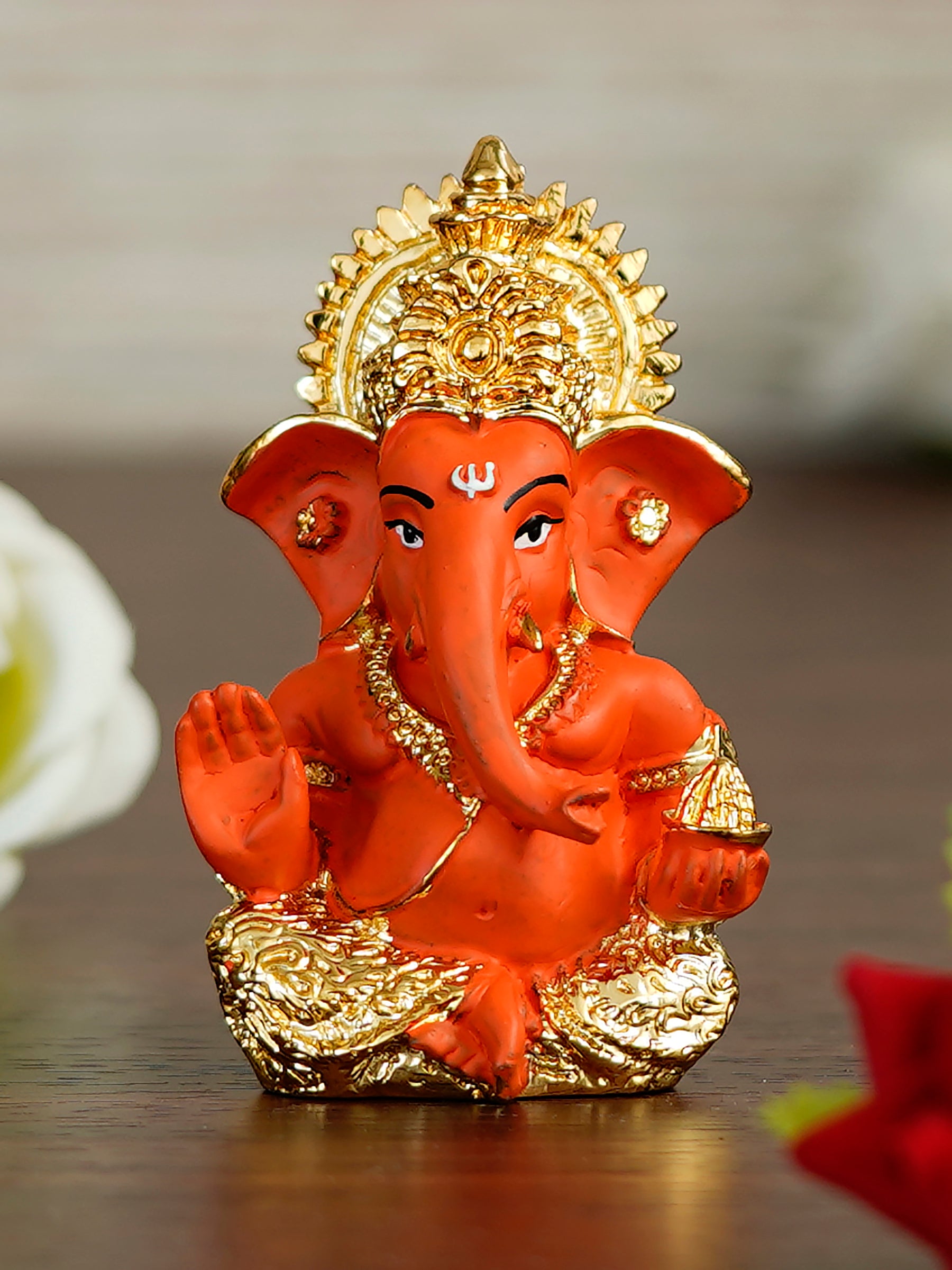 Gold Plated Orange Polyresin Ganesha Idol for Home, Temple, Office and Car Dashboard