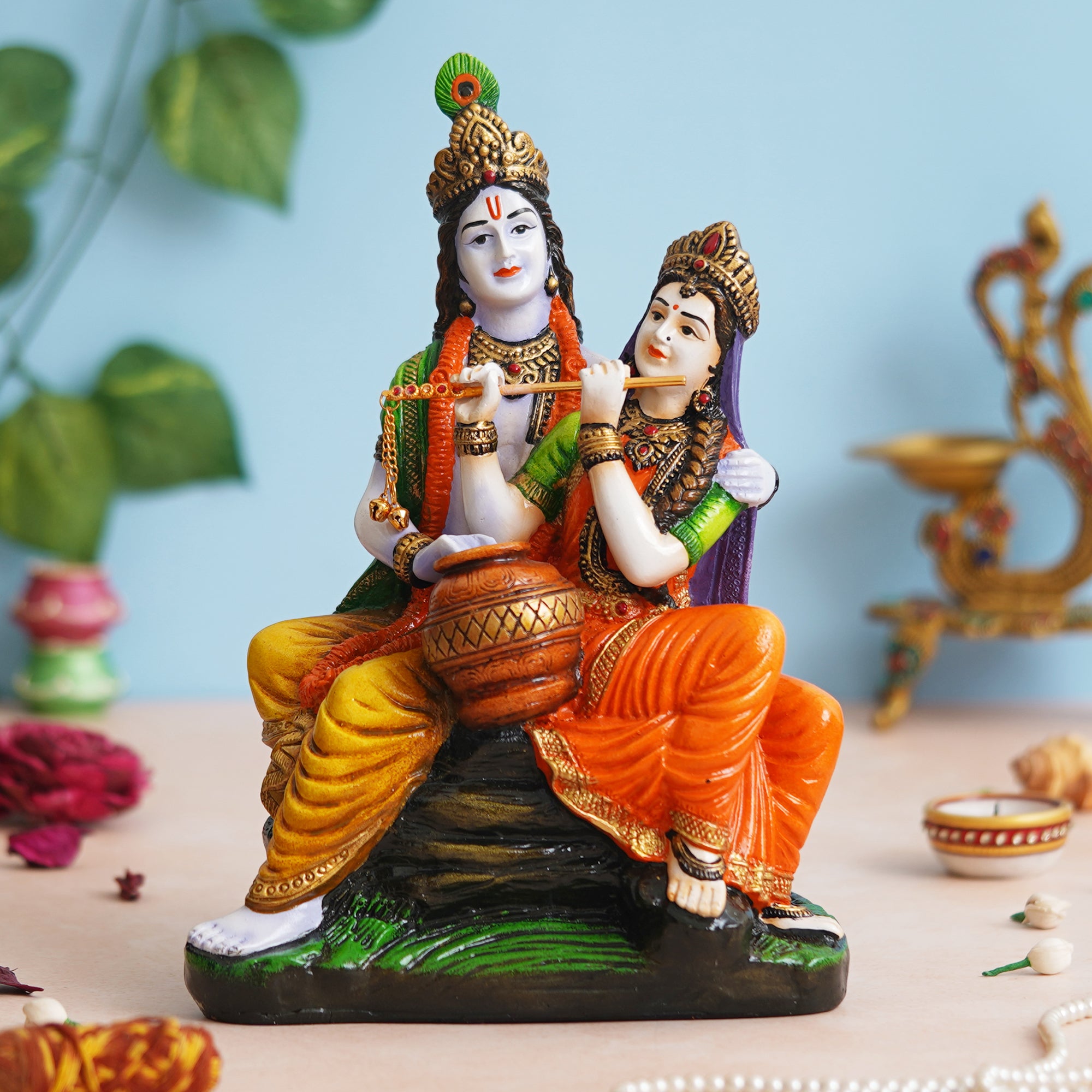 eCraftIndia Multicolor Polyresin Radha Krishna Idol Sitting on Rock Playing Flute and Holding Matki 1