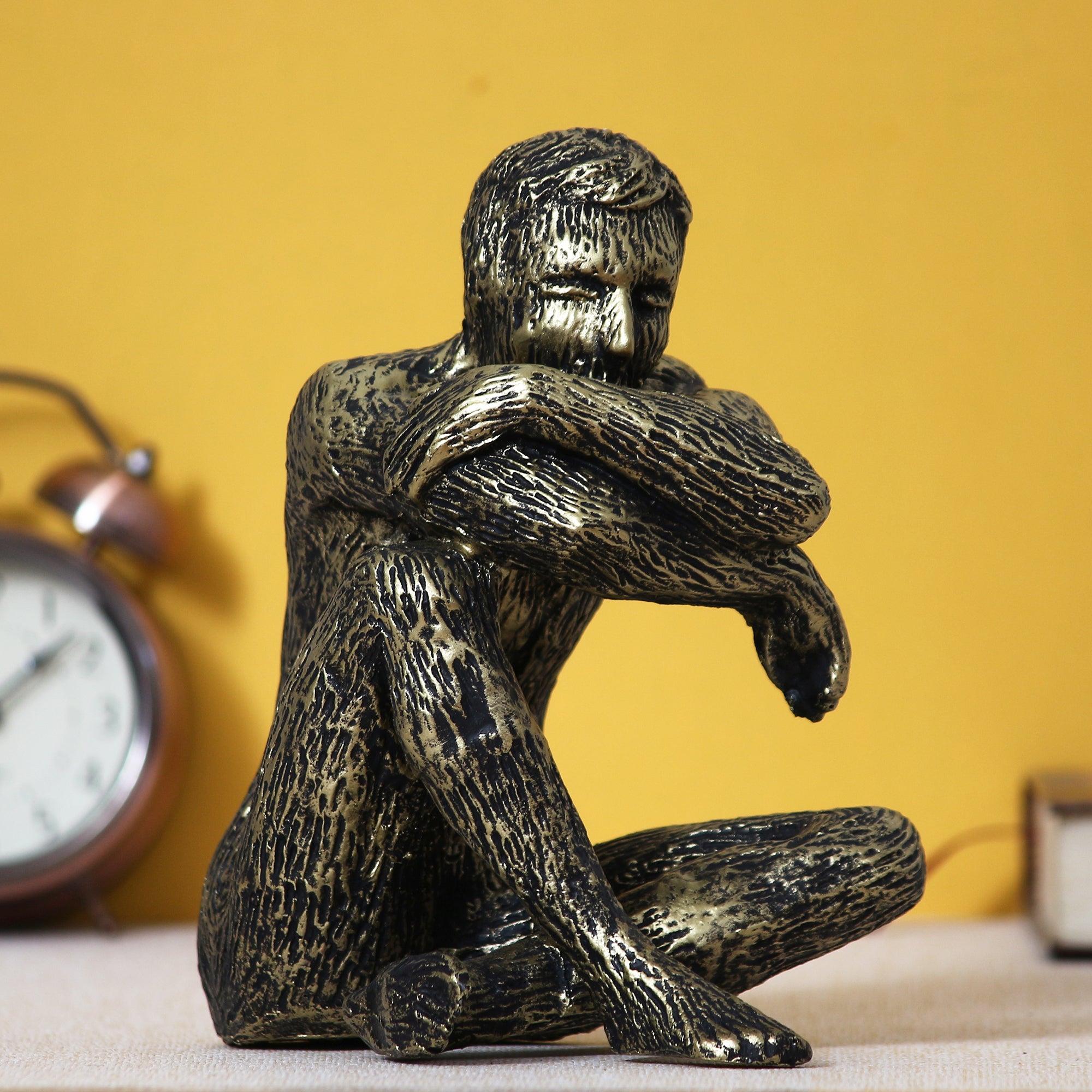 Golden and Black Polyresin Man Figurine Sitting in Thinking Position
