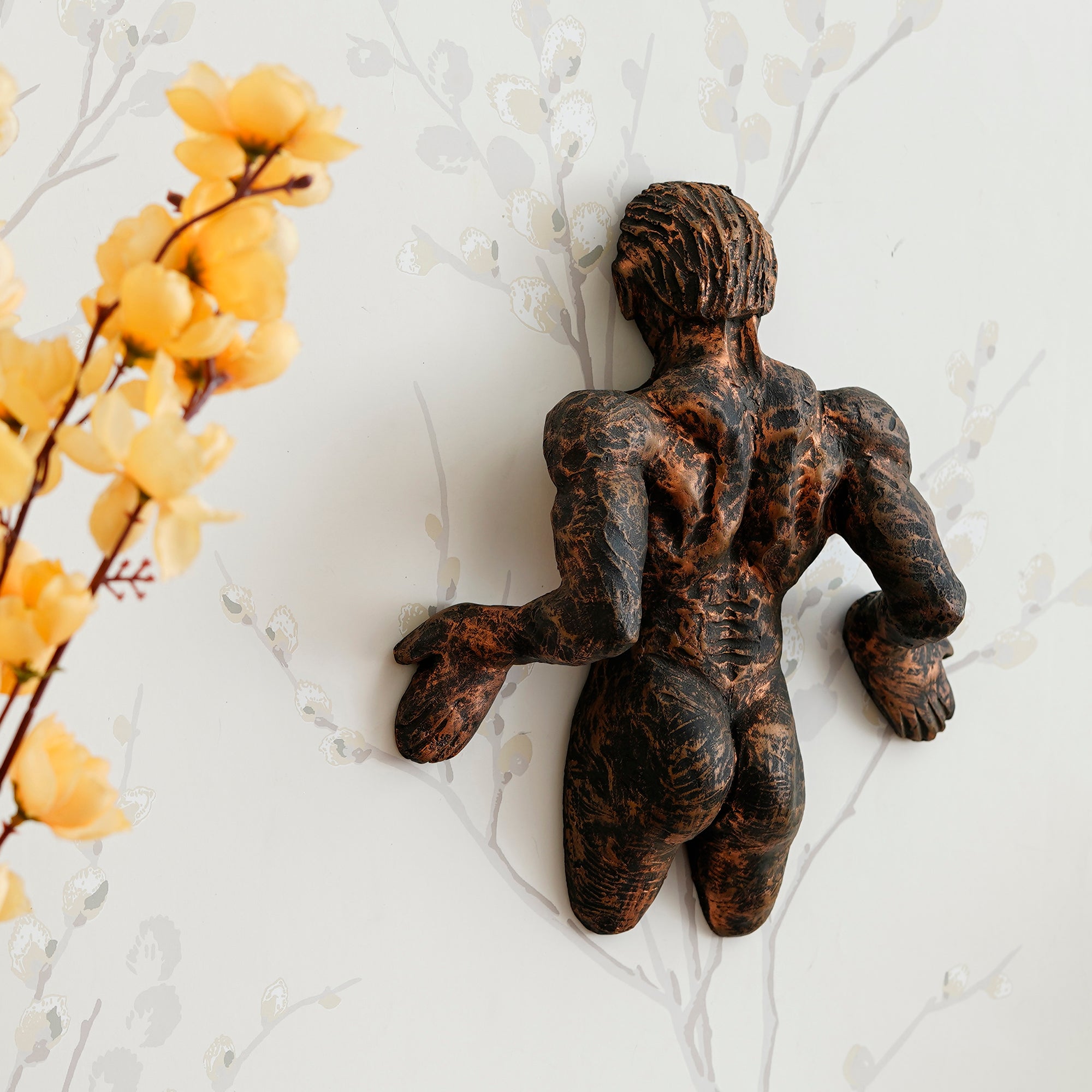 Brown Polyresin Man Pushing Wall Antique Finish Handcrafted Wall Decorative Showpiece