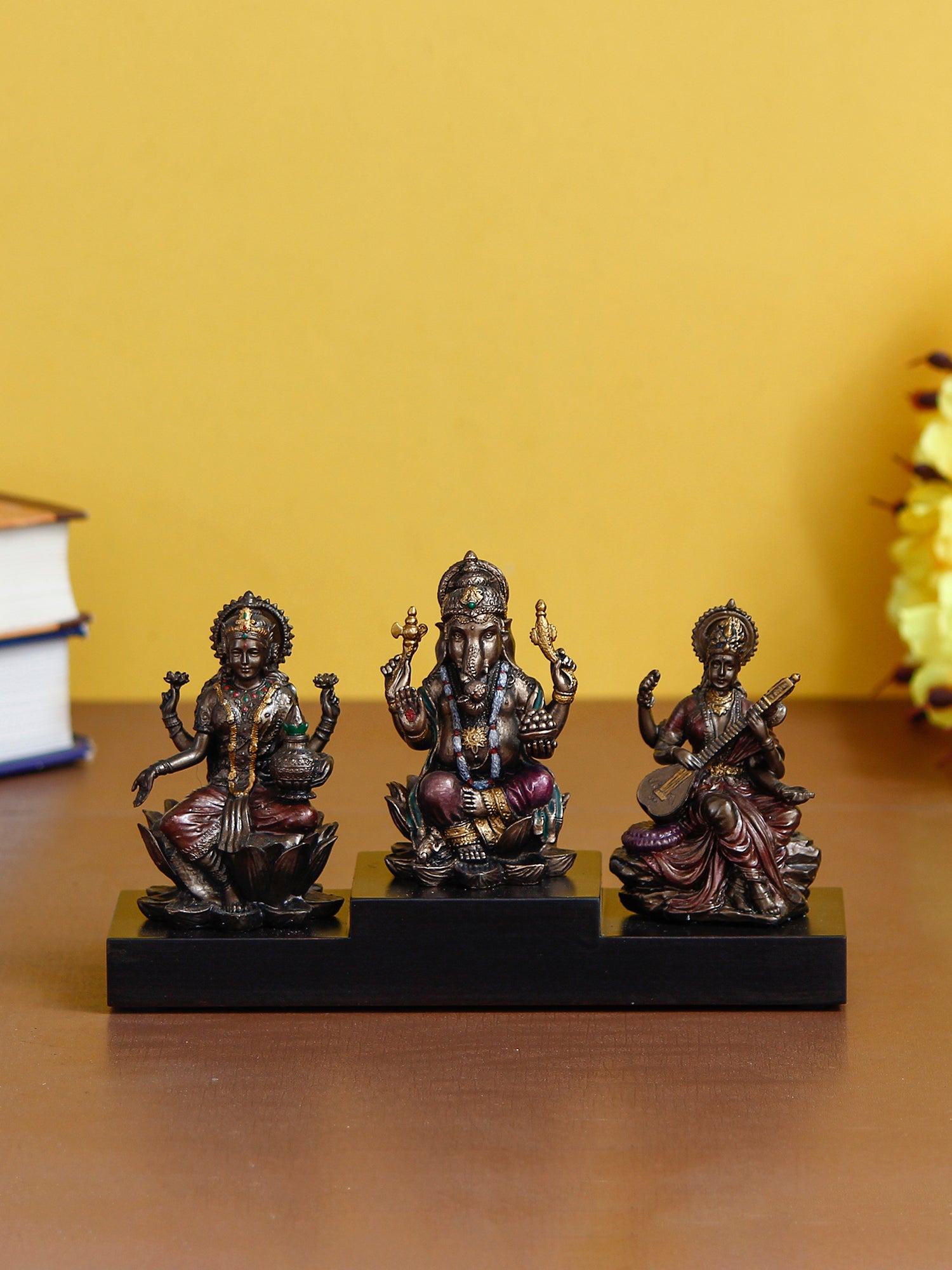 Brown Polyresin and Bronze Lakshmi Ganesha Saraswati Idols on Base