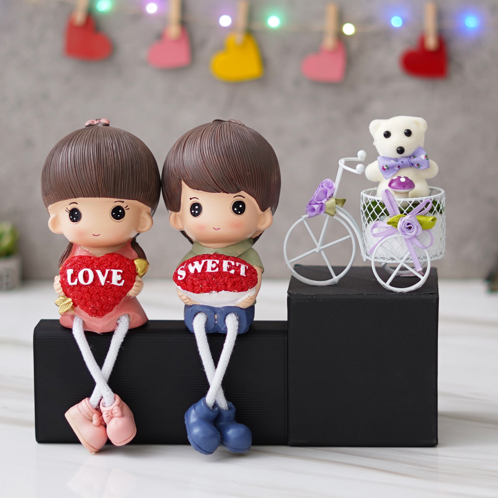 Valentine Combo of Colorful Sweet Love Girl & Boy Figurine, White Cycle with Teddy Bear and Rose Petals Gift Box